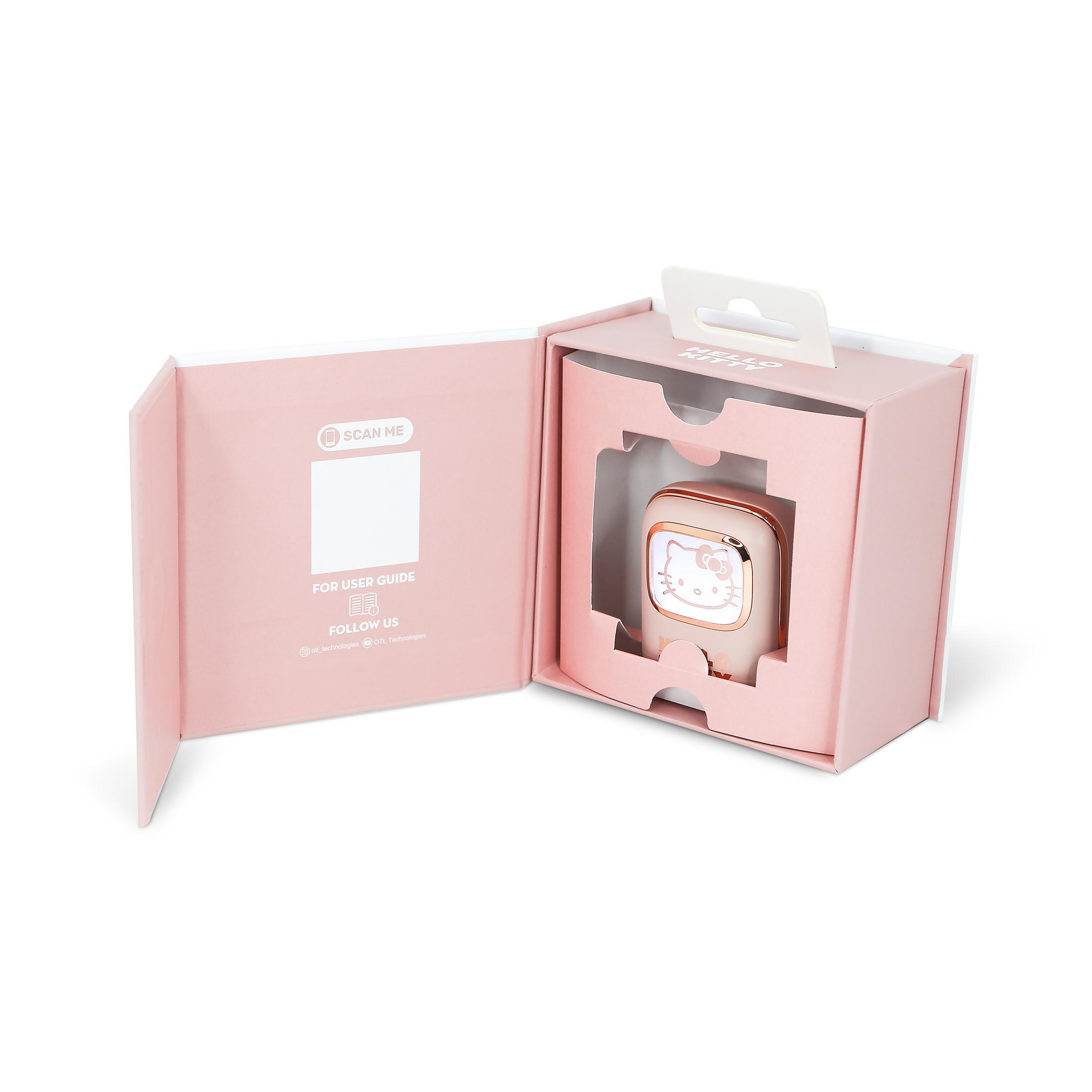 Una sveglia rosa di Hello Kitty all'interno di una confezione regalo aperta con istruzioni.