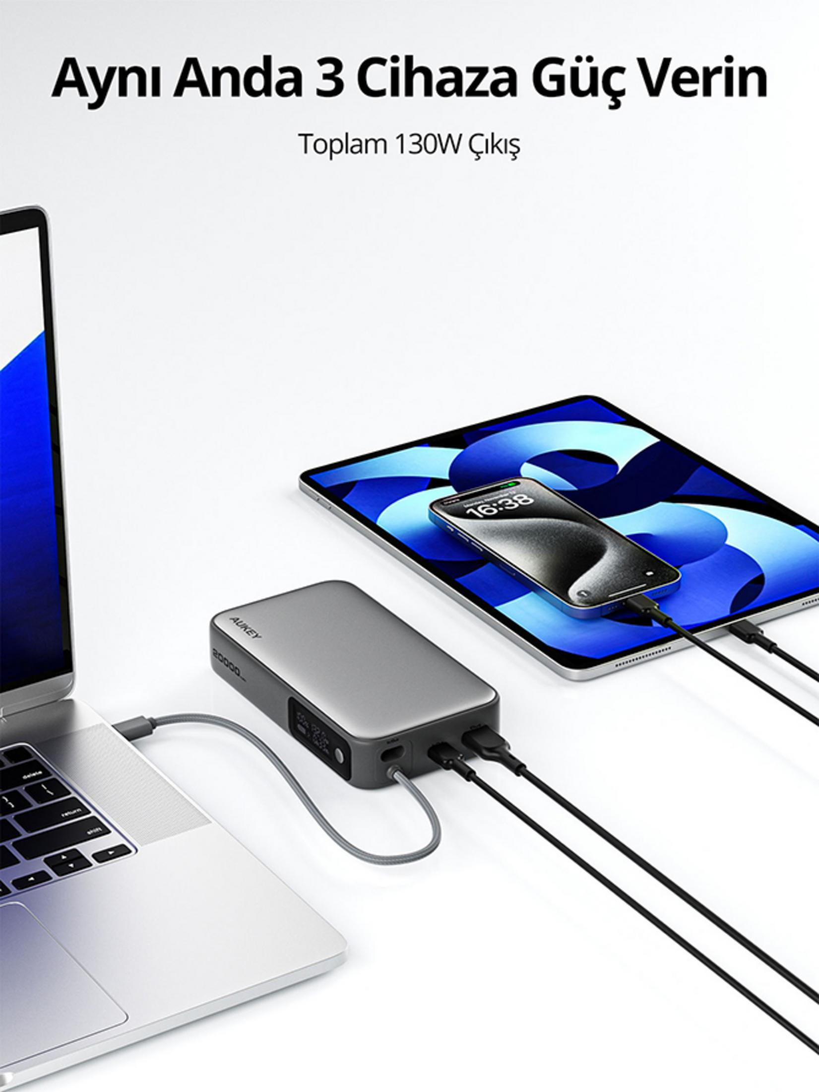 Un laptop, un tablet e uno smartphone vengono caricati da un power bank.