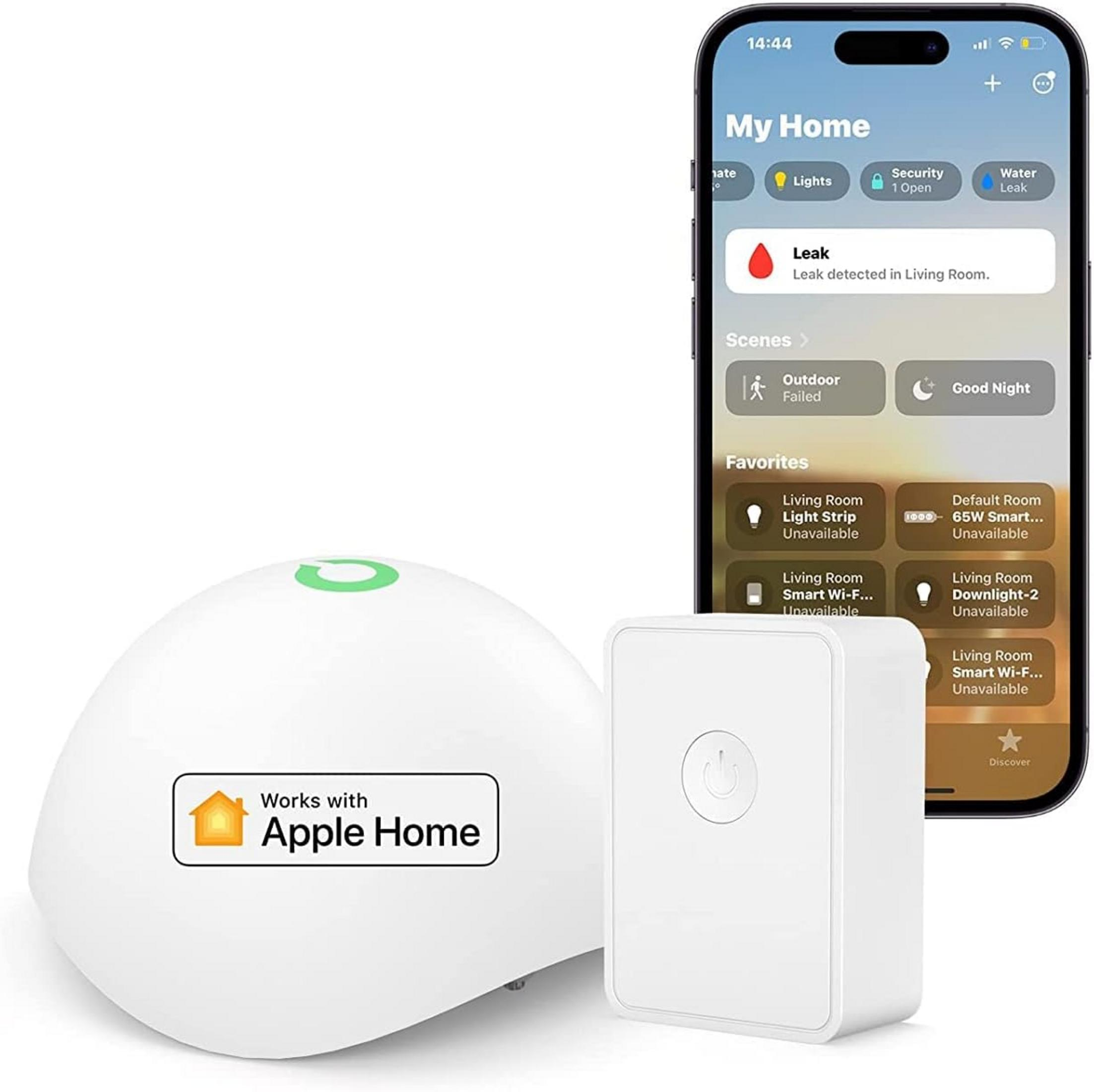 Ein weißer Smart-Home-Hub und ein Schalter liegen neben einem iPhone mit der Home-App.