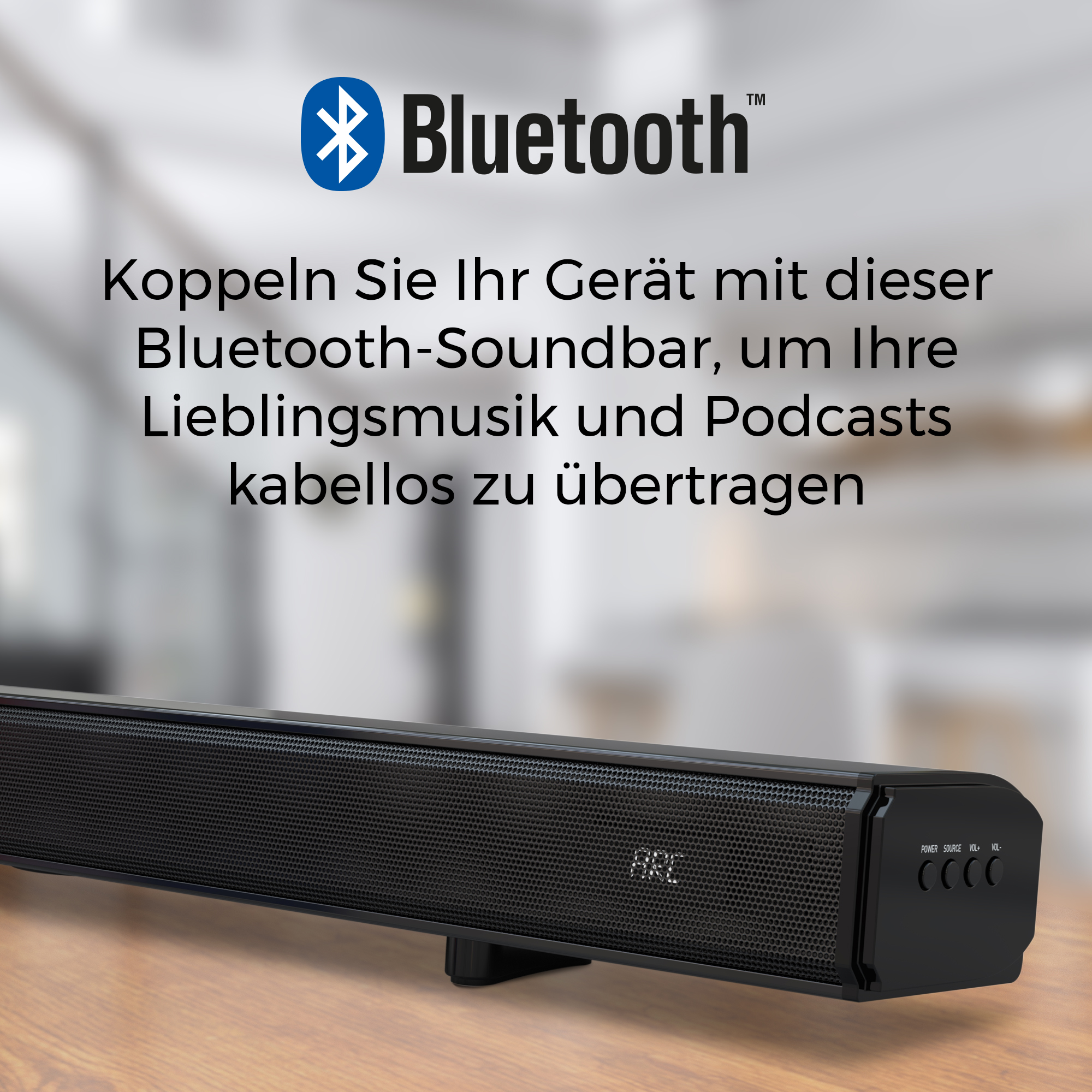 Schwarze Bluetooth-Soundbar mit Tasten und ARC-Anzeige auf Holztisch.