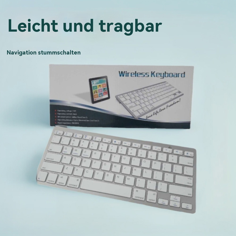 Ein silbernes Wireless Keyboard liegt vor einer Verpackung mit einem Keyboard-Bild.