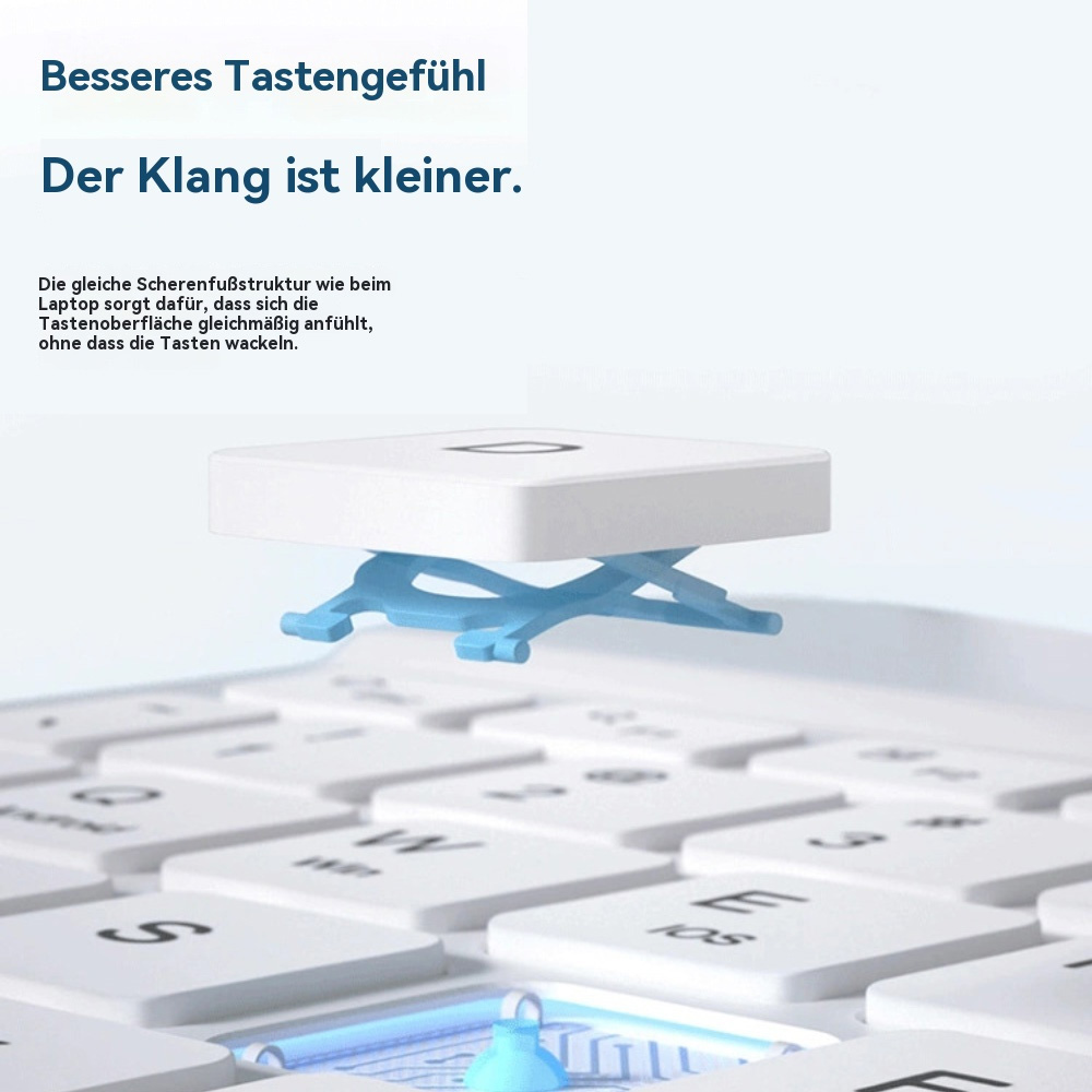 Eine weiße Tastenkappe mit blauer Scherenmechanik über einer weißen Tastatur.