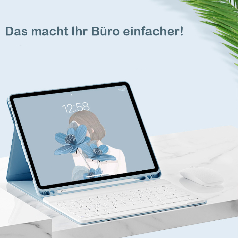 Ein hellblaues Tablet mit Tastatur und Maus auf Marmorunterlage.