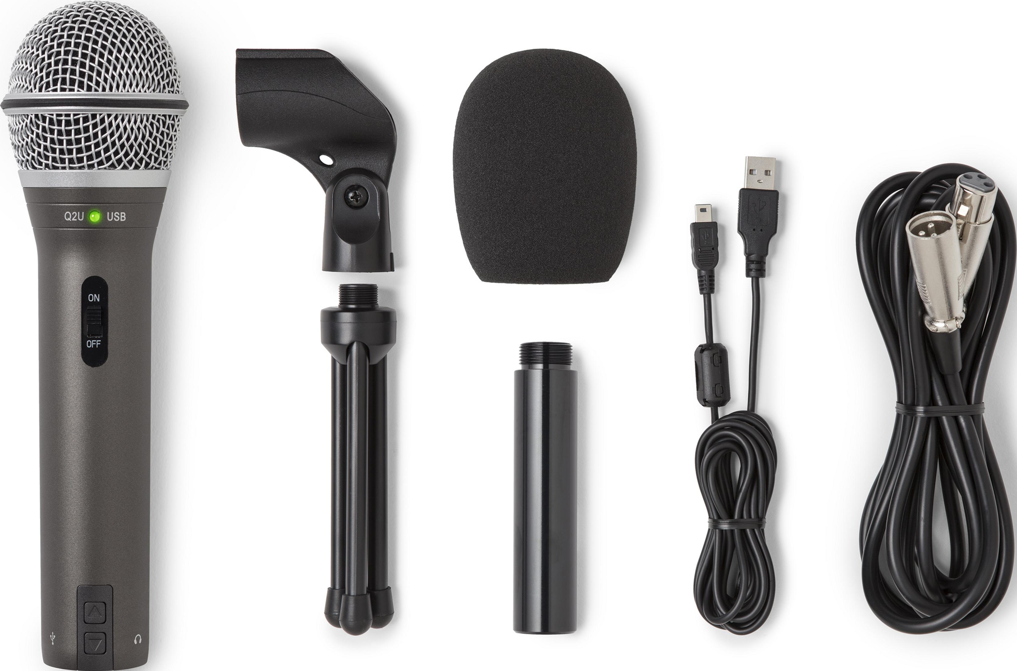 Ein graues Mikrofon mit Zubehör: Stativ, Windschutz, Kabel und Adapter.