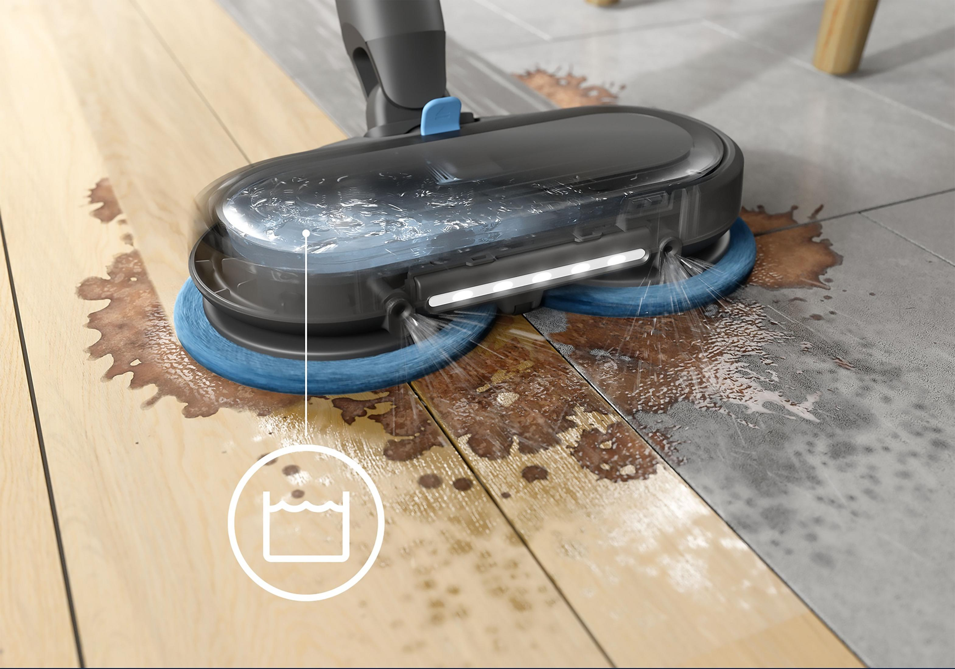 Un aspirateur-serpillière humide nettoie sols en bois et carrelage avec des brosses rotatives.