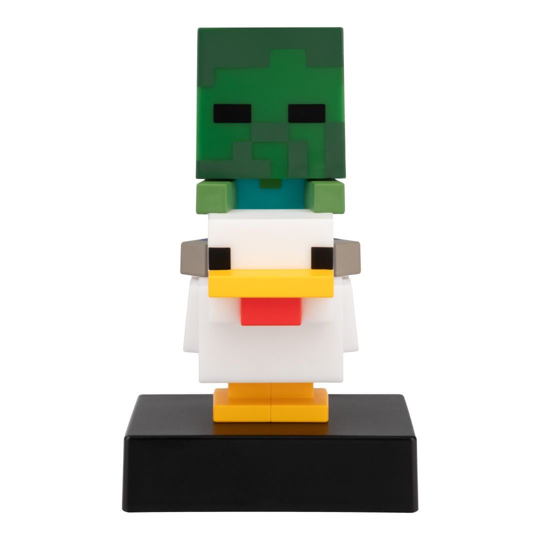 Pikselowa figurka zombie z Minecraft na białej figurce kurczaka na czarnej podstawie.
