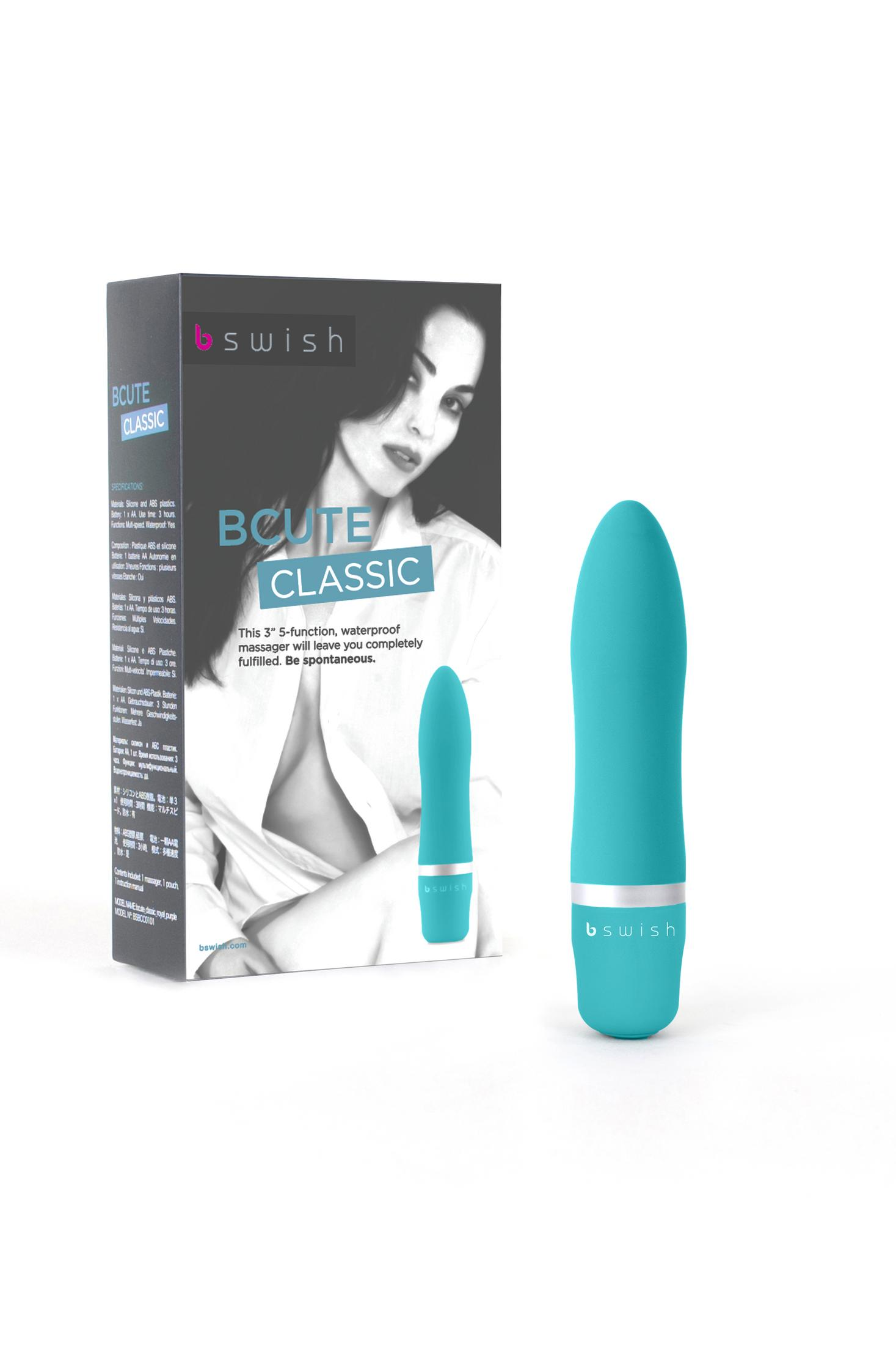 Ein türkisfarbener Vibrator steht neben seiner Verpackung mit einer Frau und Produktinformationen.