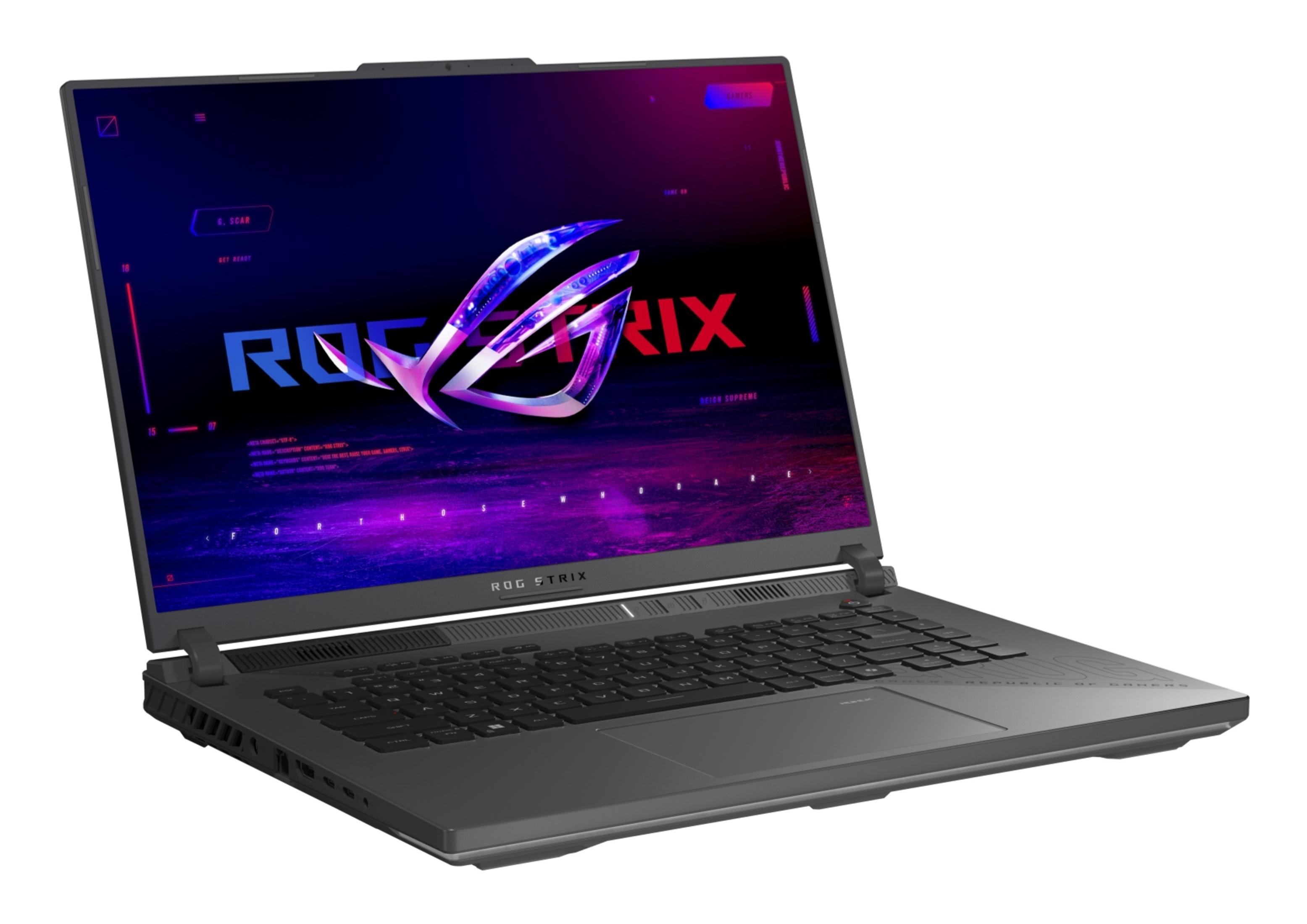 Ciemny laptop z podświetlanym logo ROG Strix na ekranie.