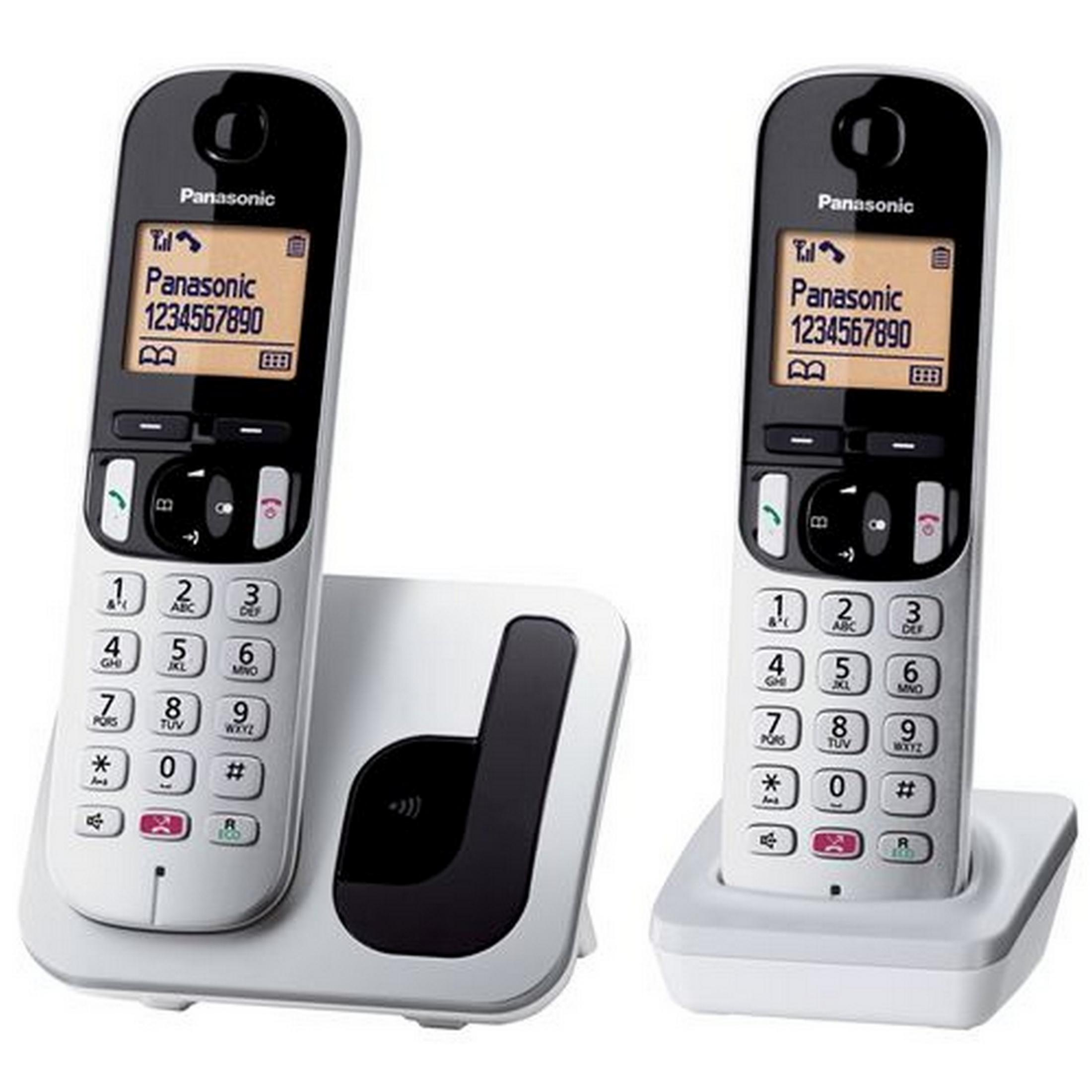 Due telefoni Panasonic bianchi, uno su base di ricarica, con display e tastiere.