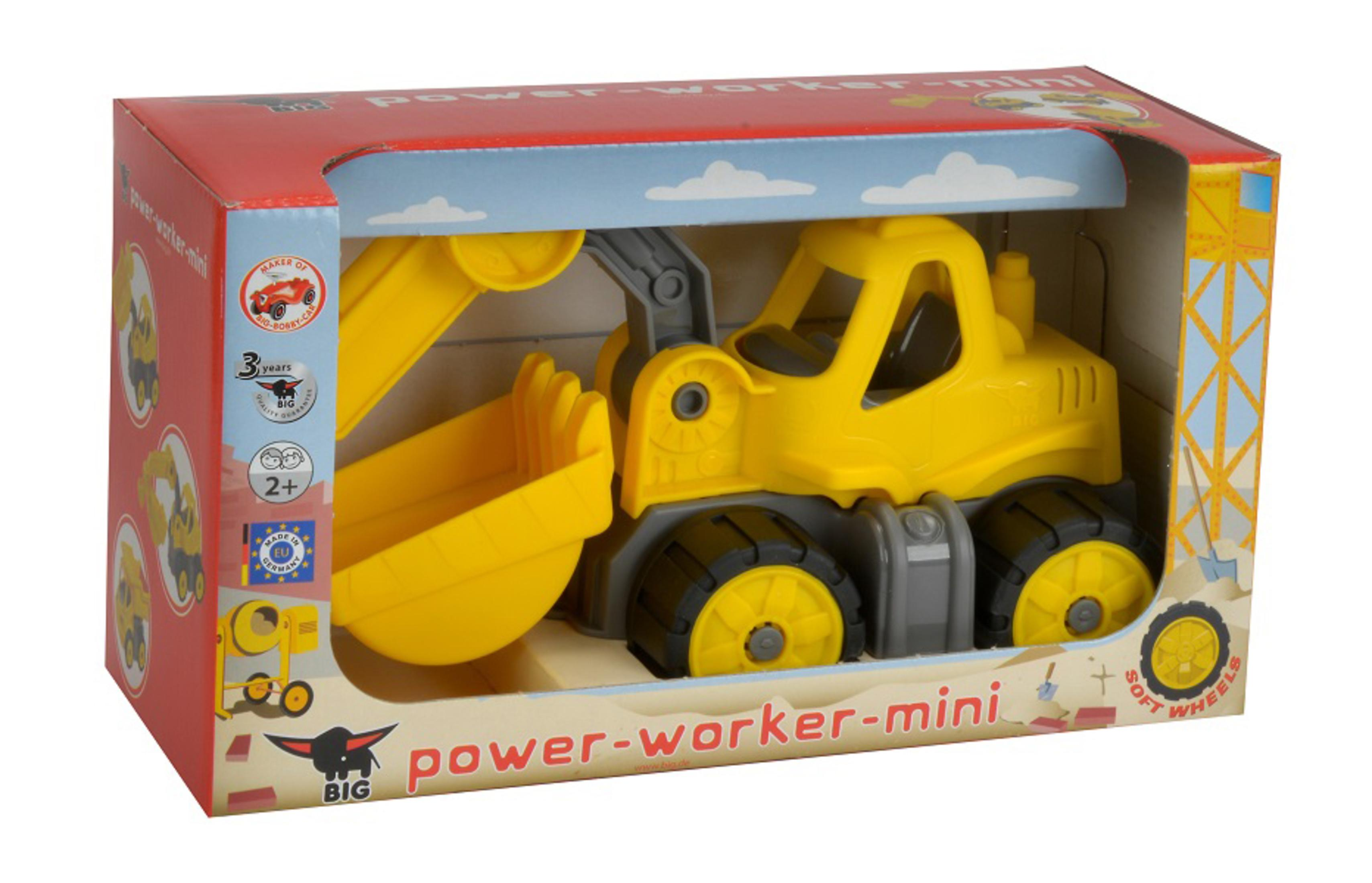 Gelber Bagger Spielzeug in Verpackung mit Wolken und Bau-Motiven.
