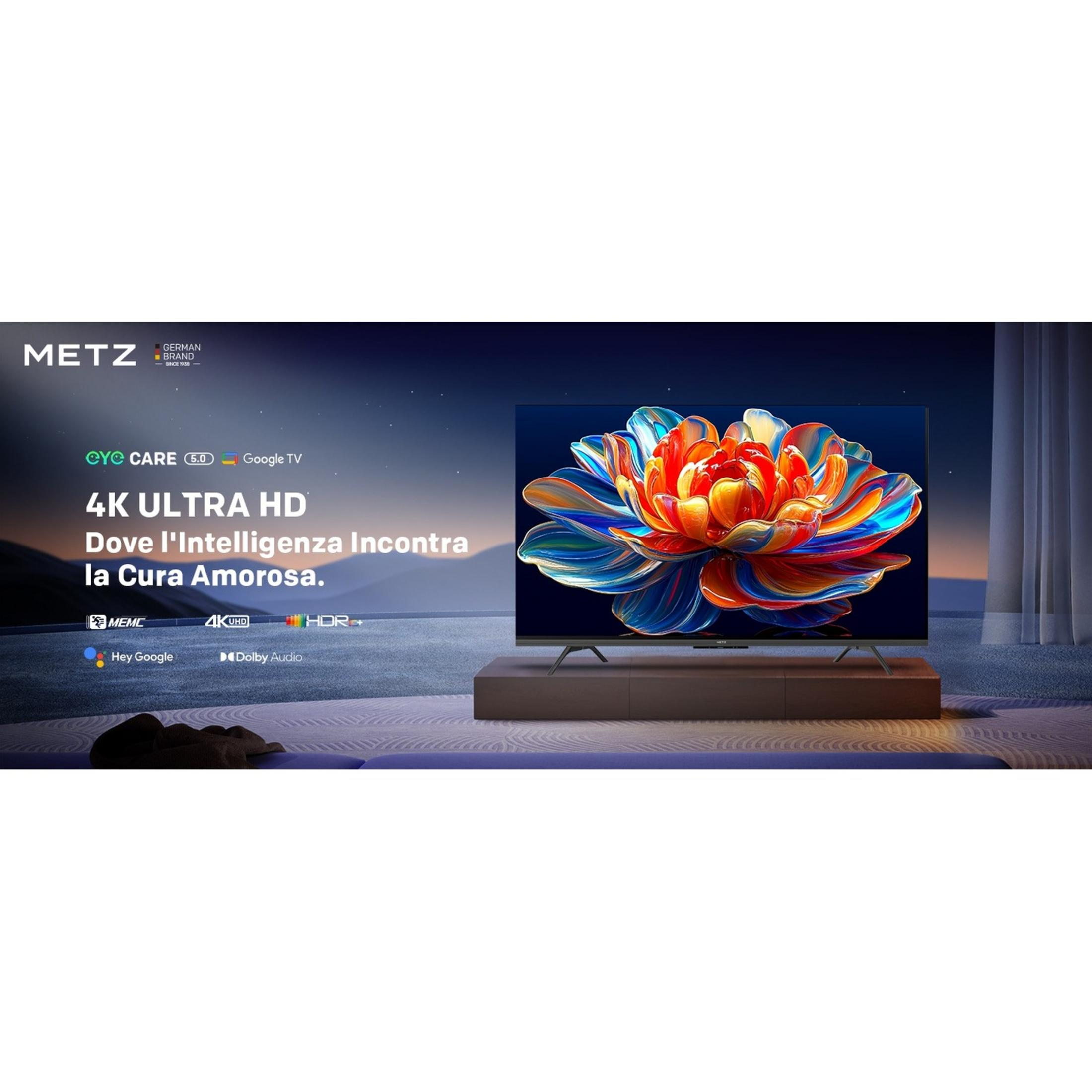 Un televisor METZ 4K UHD con Google TV muestra una flor colorida. Hay logos a la izquierda.