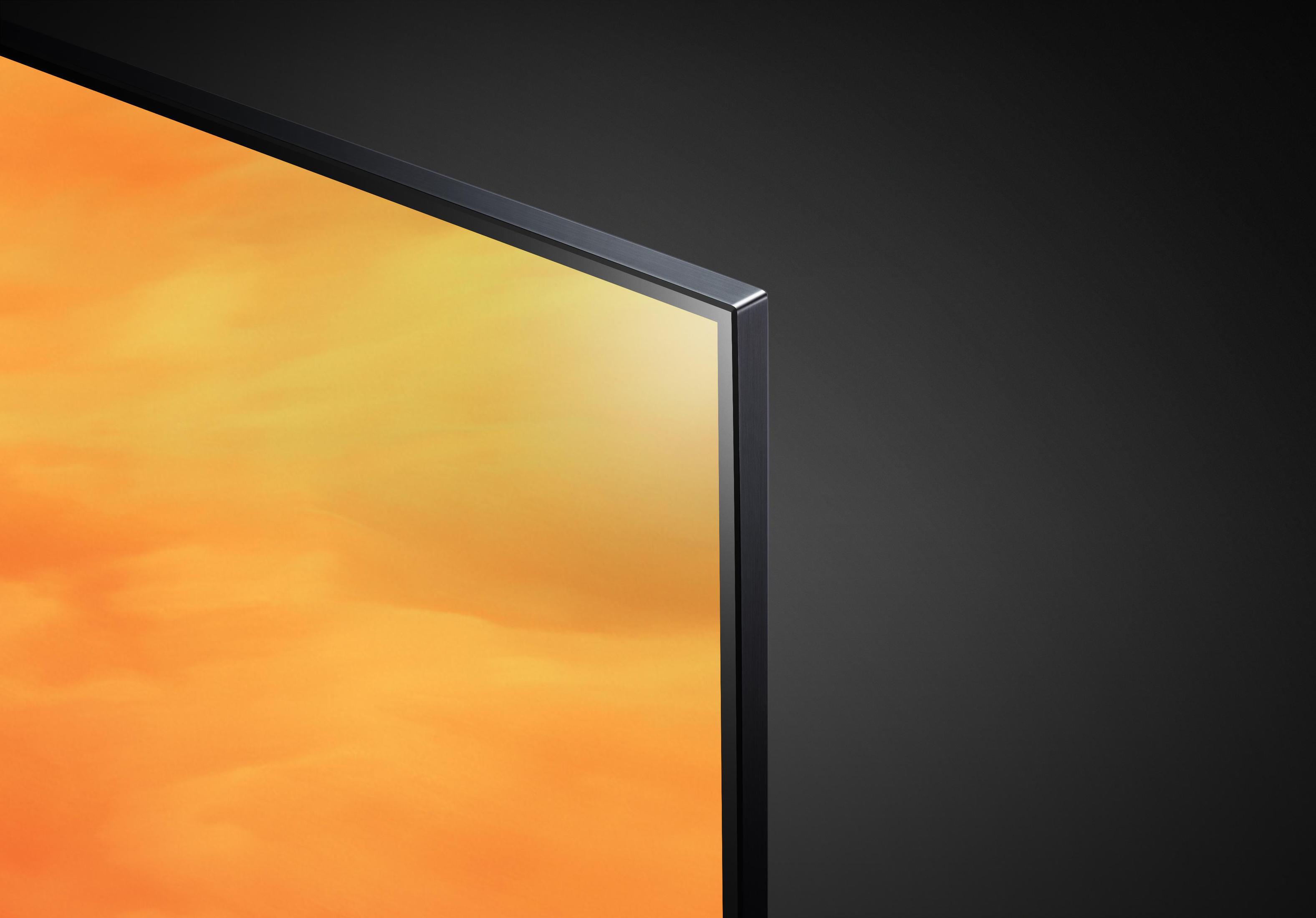Nahaufnahme einer schwarzen TV-Blende mit einem orange-gelben Bildschirm.