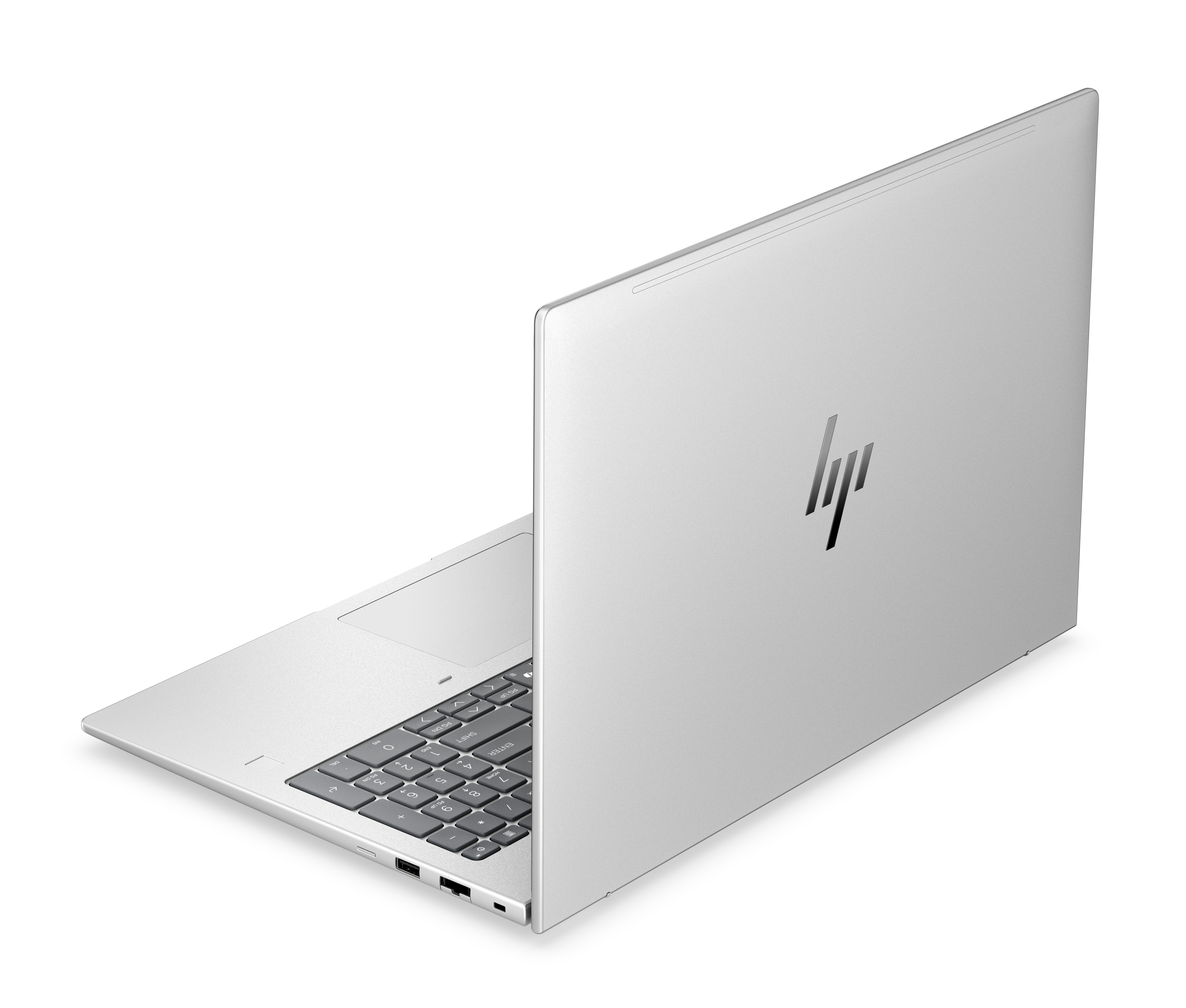Un laptop HP argentato con tastiera retroilluminata e touchpad.