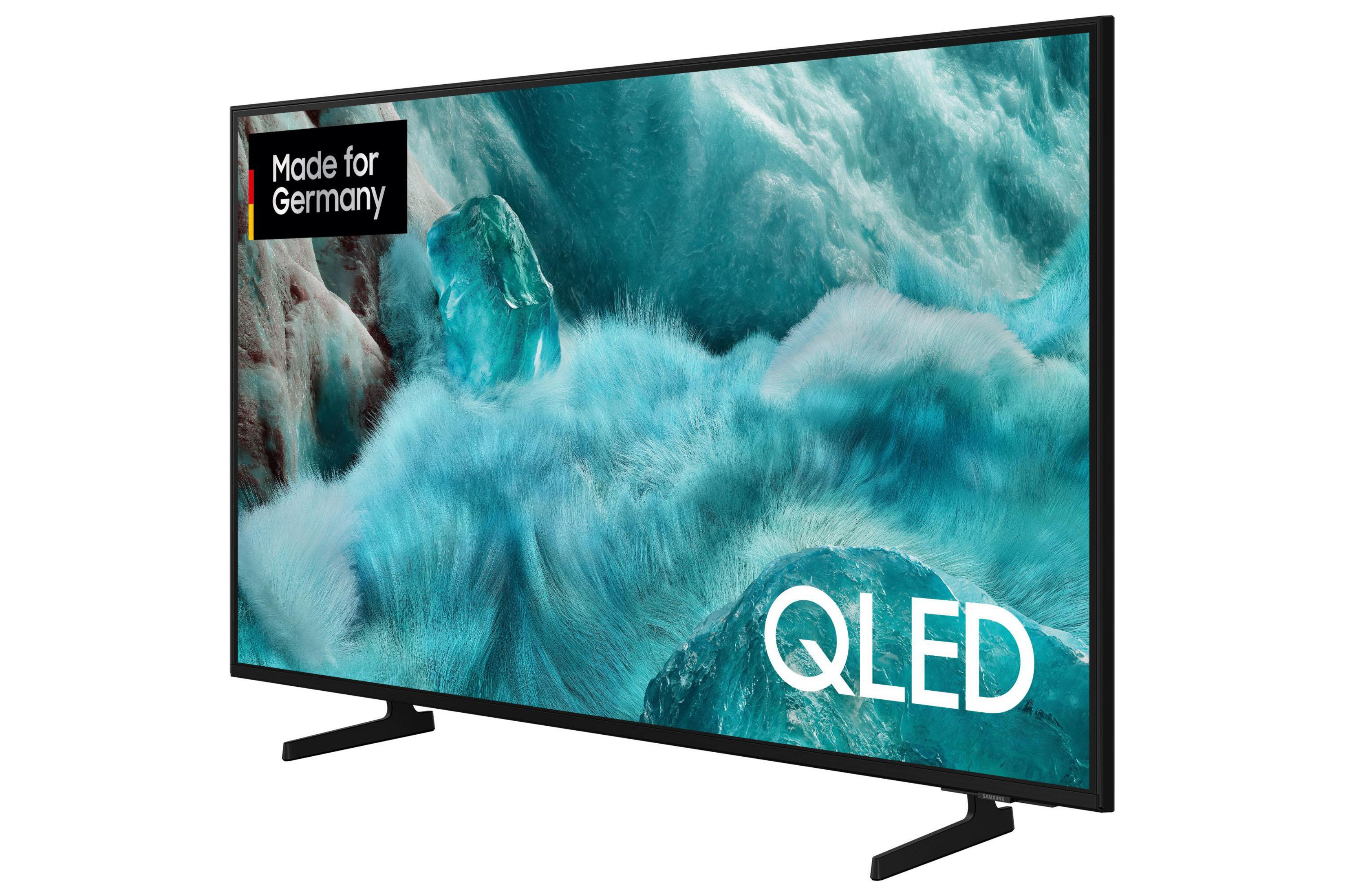 Ein schwarzer QLED-Fernseher mit einem Bild von Eis und Schnee. "Made for Germany"-Logo.