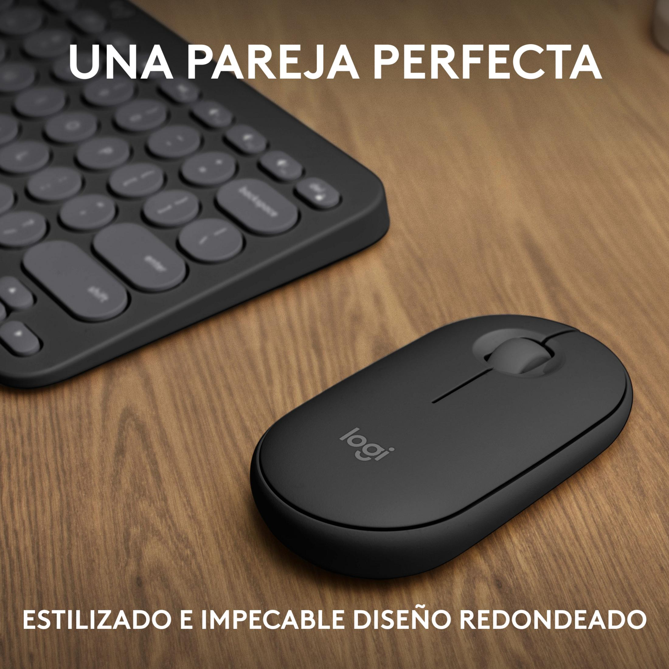 Mouse e tastiera neri su tavolo di legno. Il testo dice „UNA PAREJA PERFECTA“.