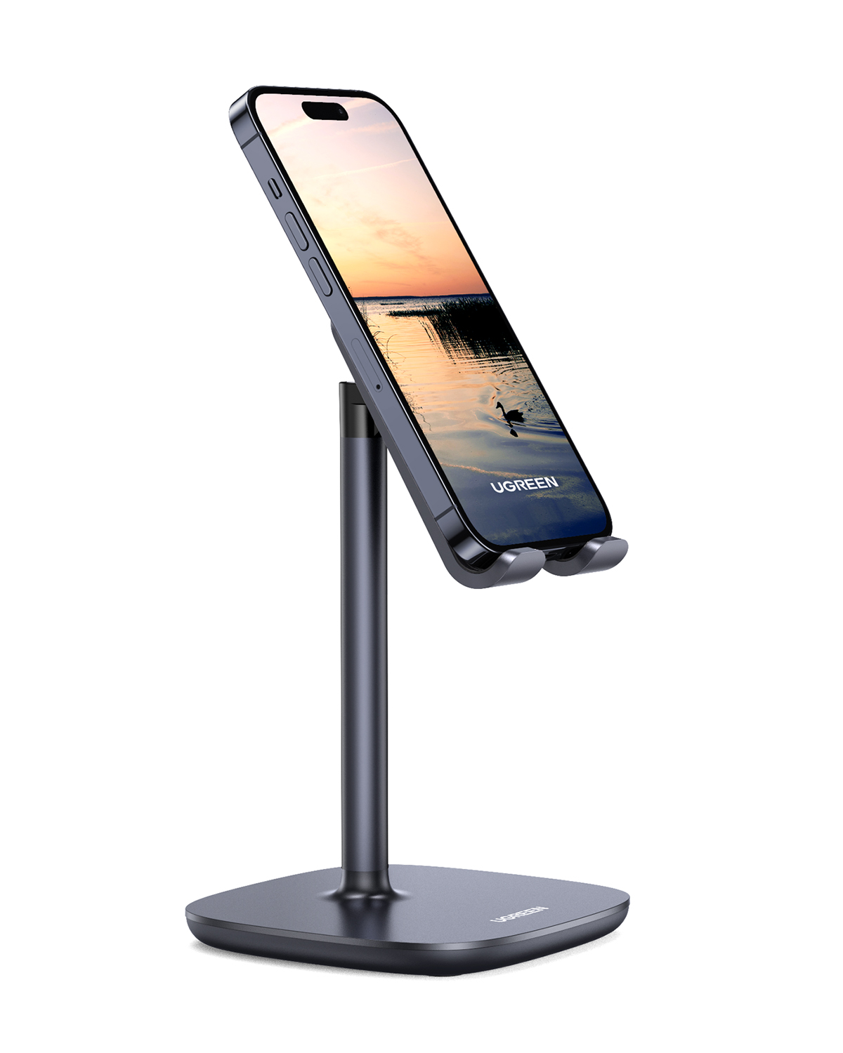 Gün batımı sahnesi gösteren bir akıllı telefon tutan gri telefon standı.