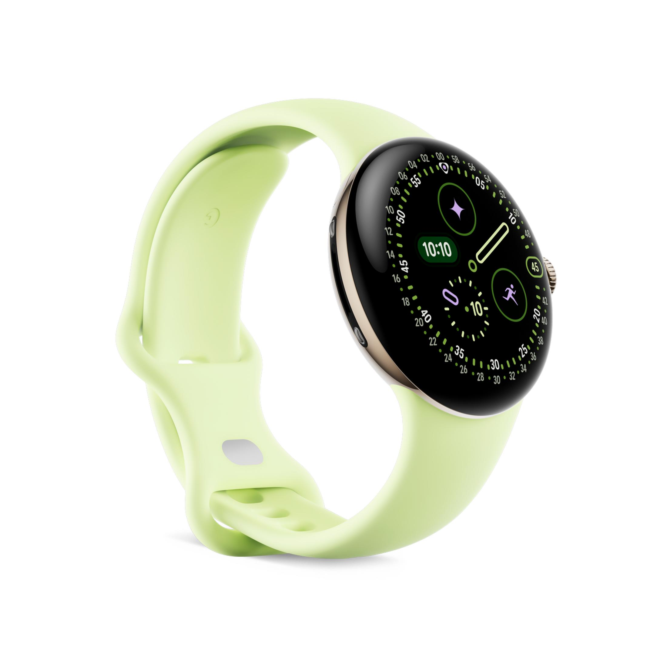 Une montre connectée vert clair avec un cadran rond affichant 10:10.