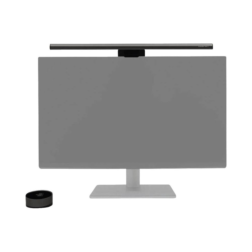Ein Monitor mit einer Lampe oben und einem runden Controller davor.