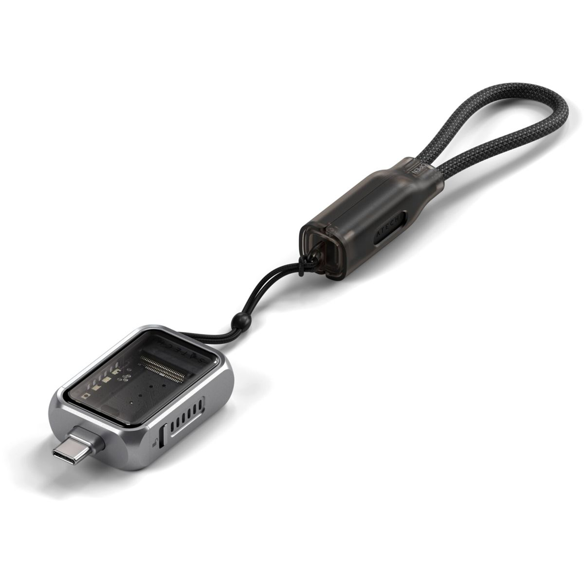 Un adaptateur USB-C argenté avec boîtier transparent et lanière noire.