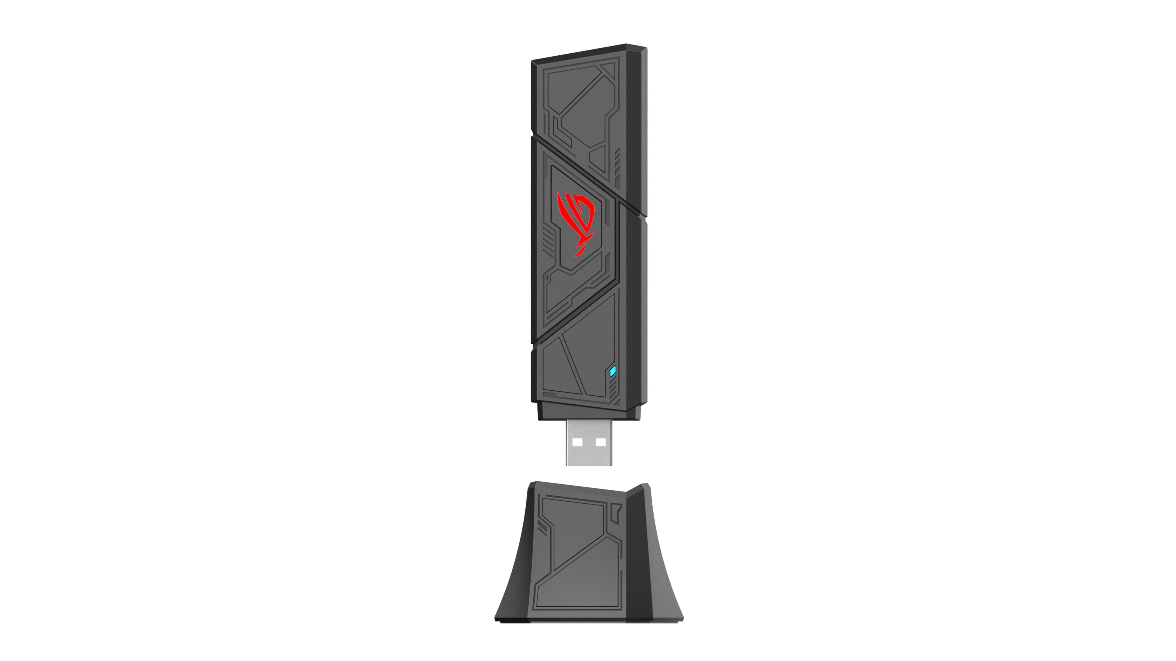 Una chiavetta USB nera con logo ROG rosso e luce blu, accanto al suo supporto.