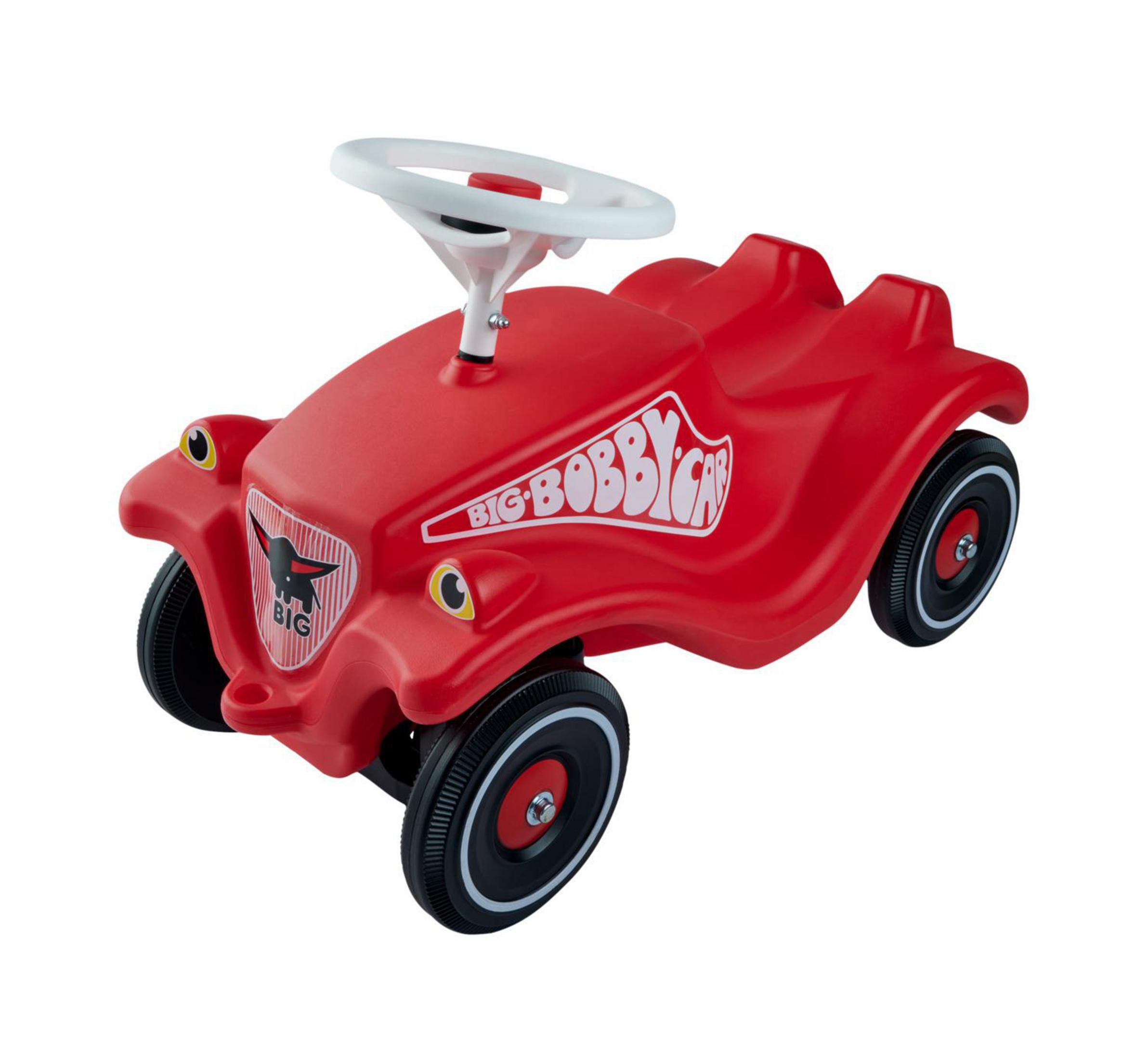 Un cavalcabile rosso con volante bianco e ruote nere. Ha un emblema.