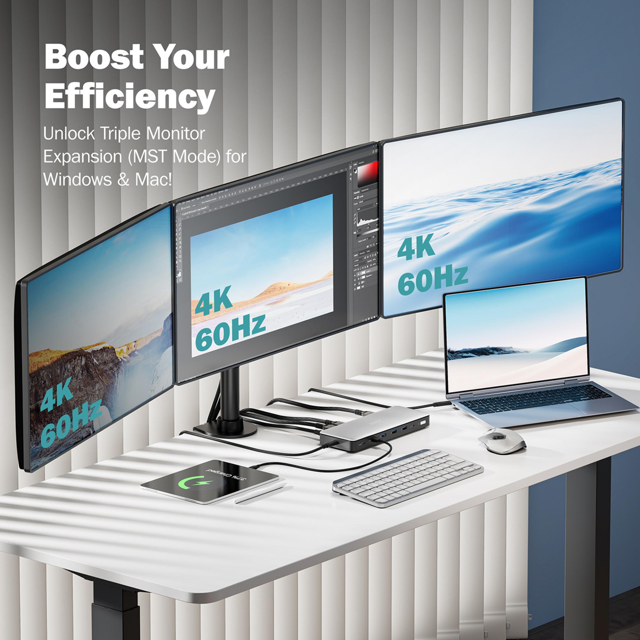 Una scrivania con tre monitor 4K, laptop, docking station, tastiera e mouse.