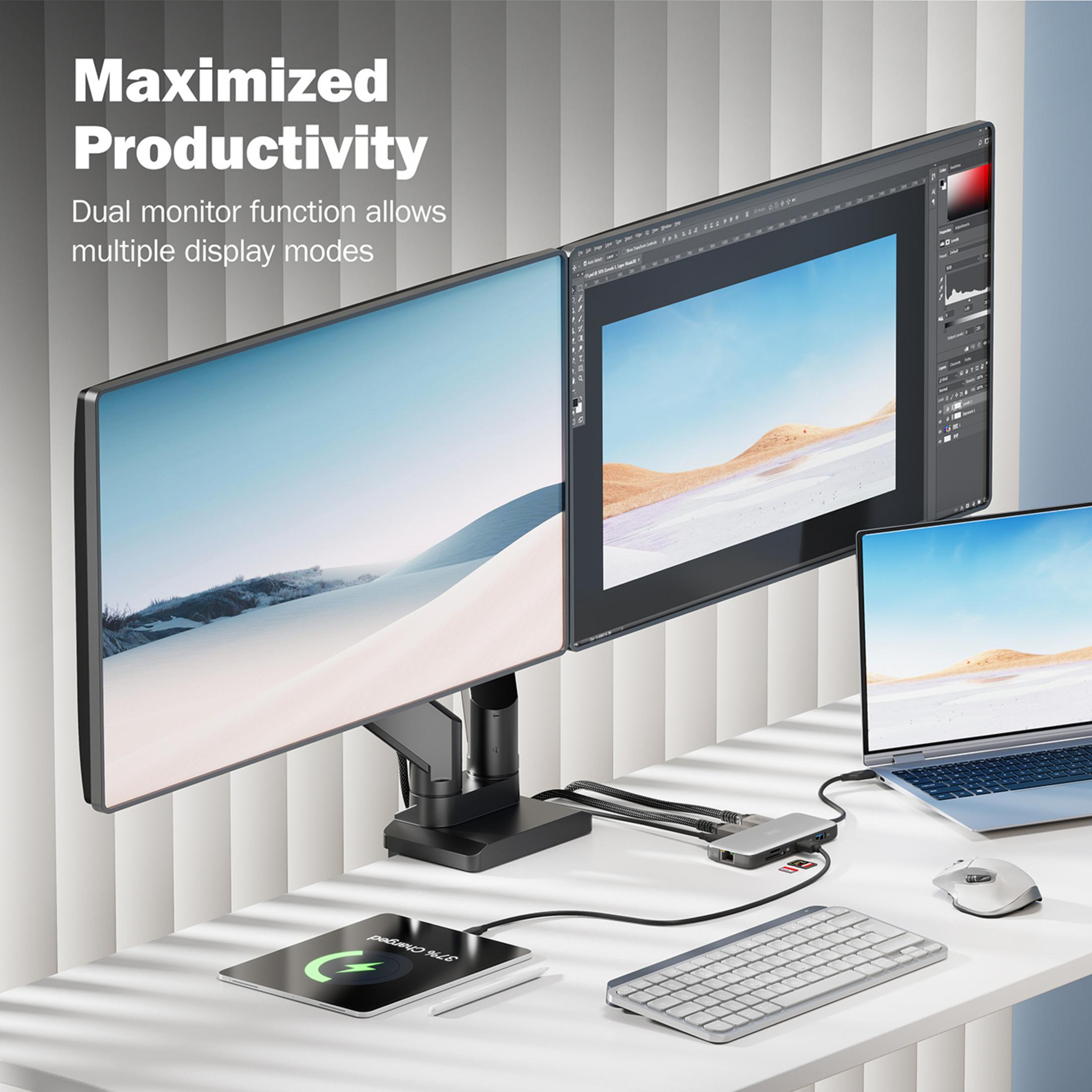 Zwei Monitore zeigen Landschaften, daneben ein Laptop, Tastatur, Maus, Hub und Tablet.