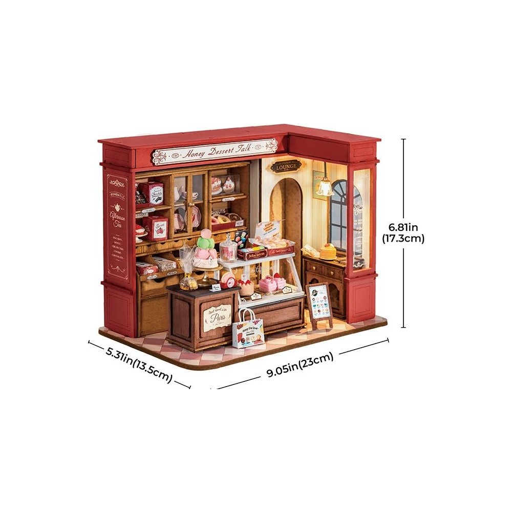 Negozio di dolci in miniatura con accenti rossi, pieno di torte e pasticcini.