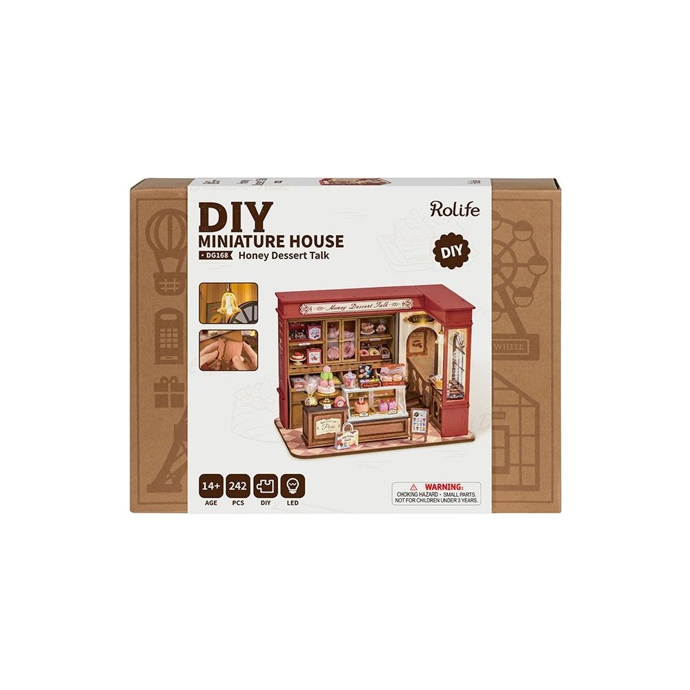 Scatola di una casa in miniatura fai-da-te con design di negozio di dessert.