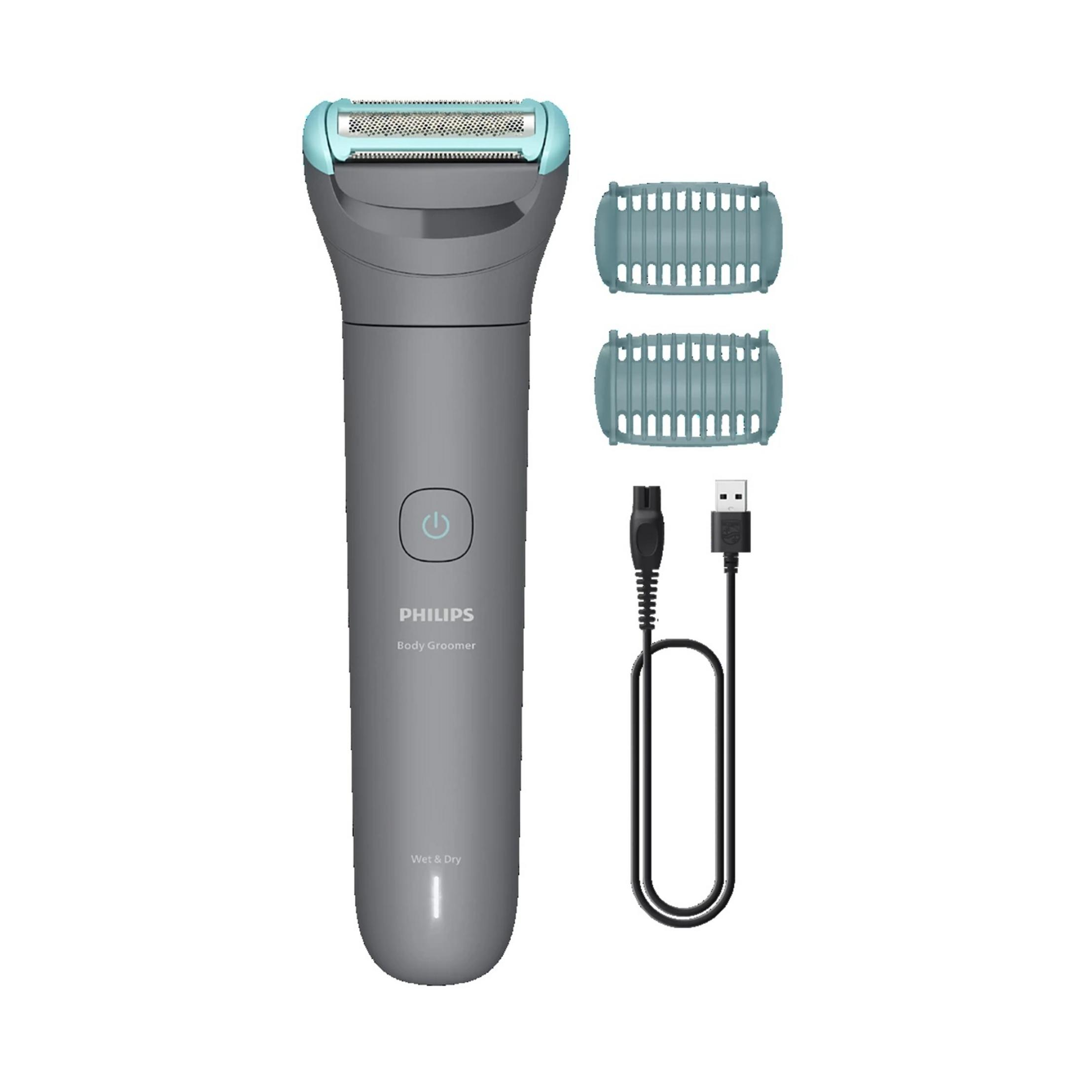 Ein grauer Philips Body Groomer mit Zubehör und USB-Ladekabel.