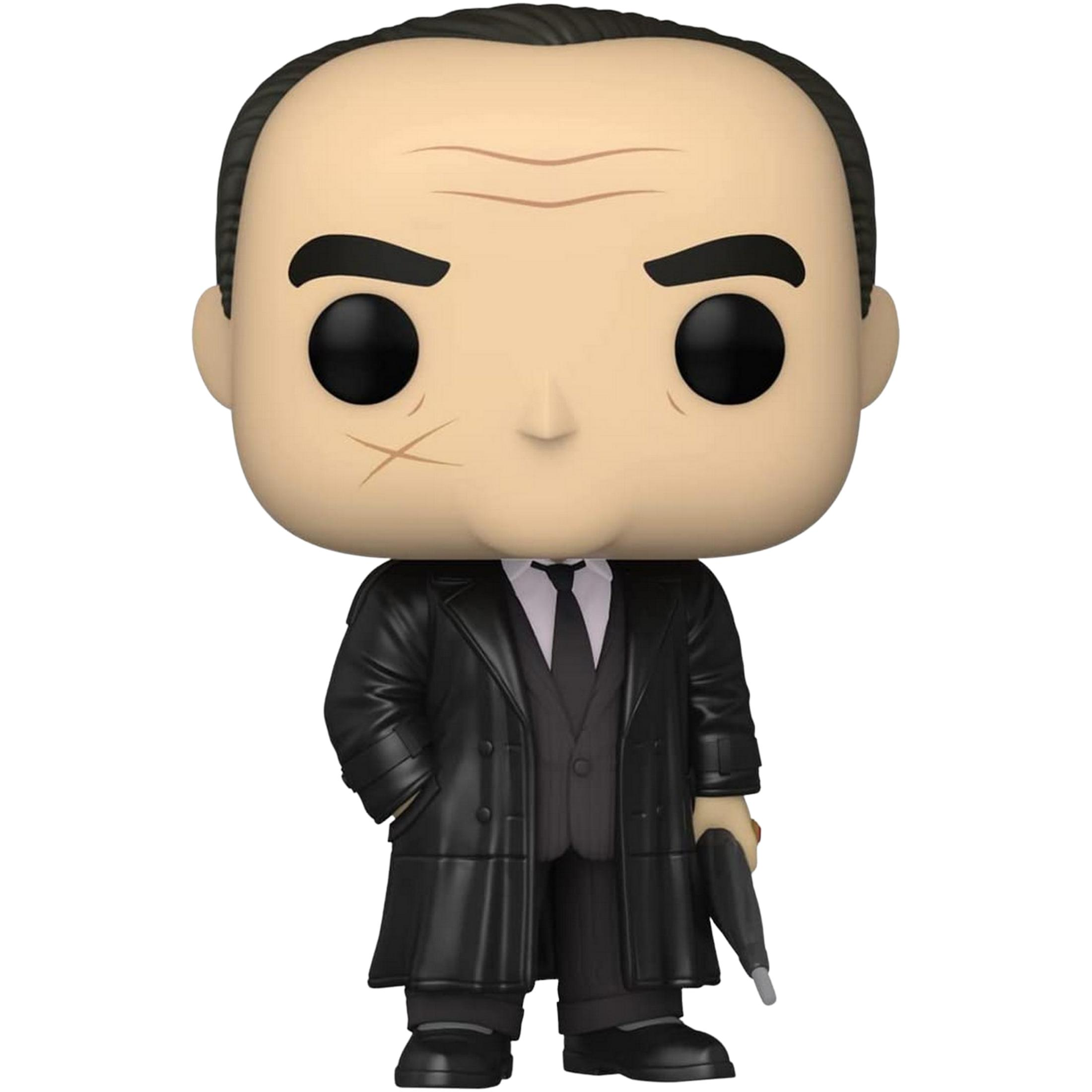 Un personaggio Funko Pop! in trench nero, completo e cravatta, tiene un'arma.