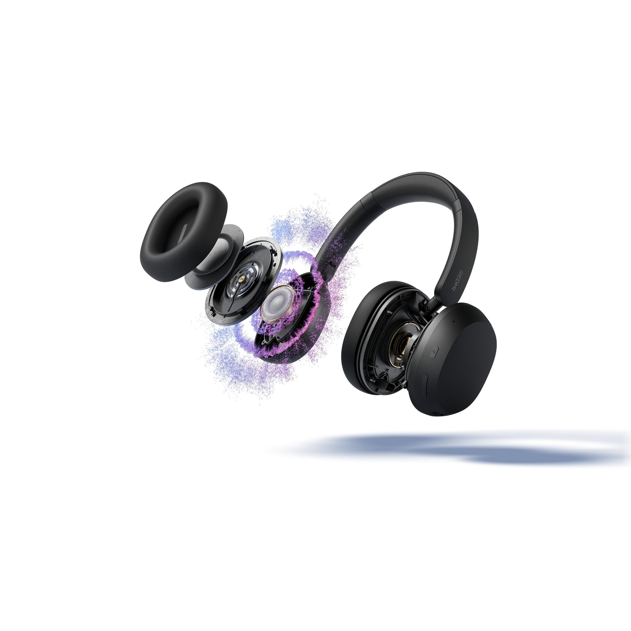 Vista explotada de auriculares negros con efectos de partículas.