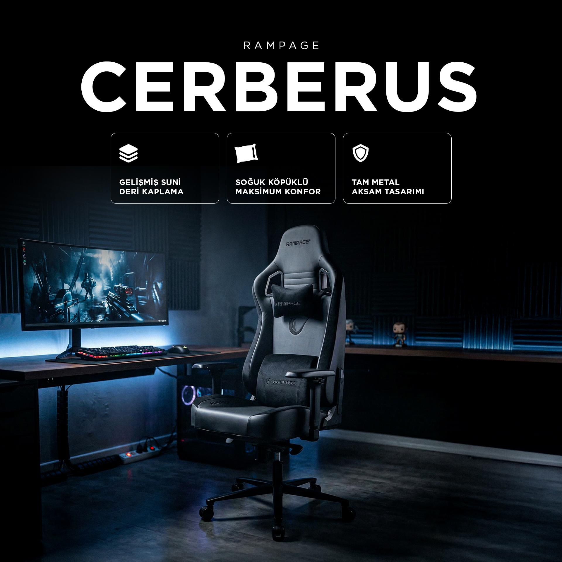 Rampage Cerberus logolu siyah oyuncu koltuğu, yanında bilgisayarlı masa.