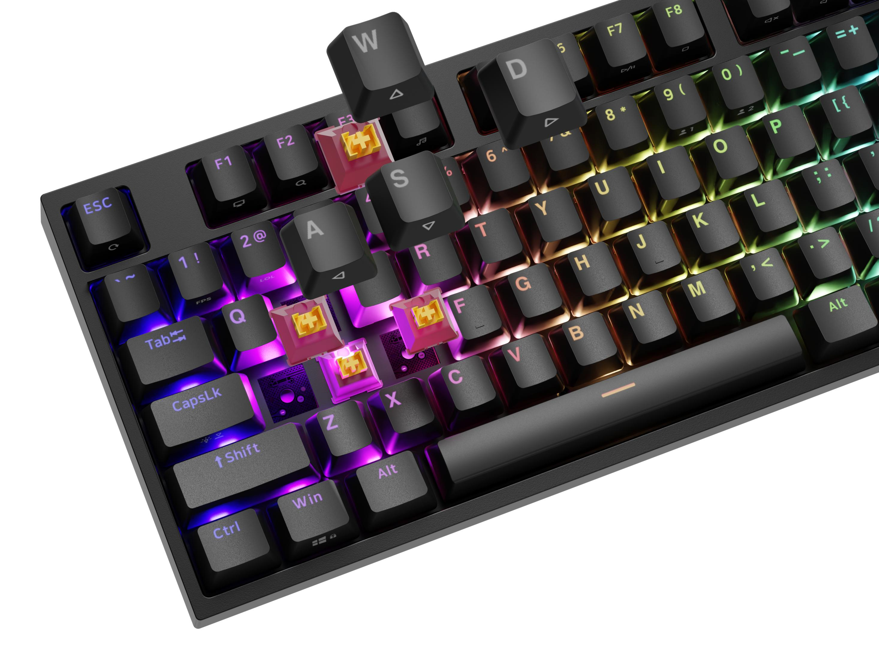 Czarna klawiatura mechaniczna z podświetleniem RGB. Niektóre klawisze są usunięte, odsłaniając różowe przełączniki.