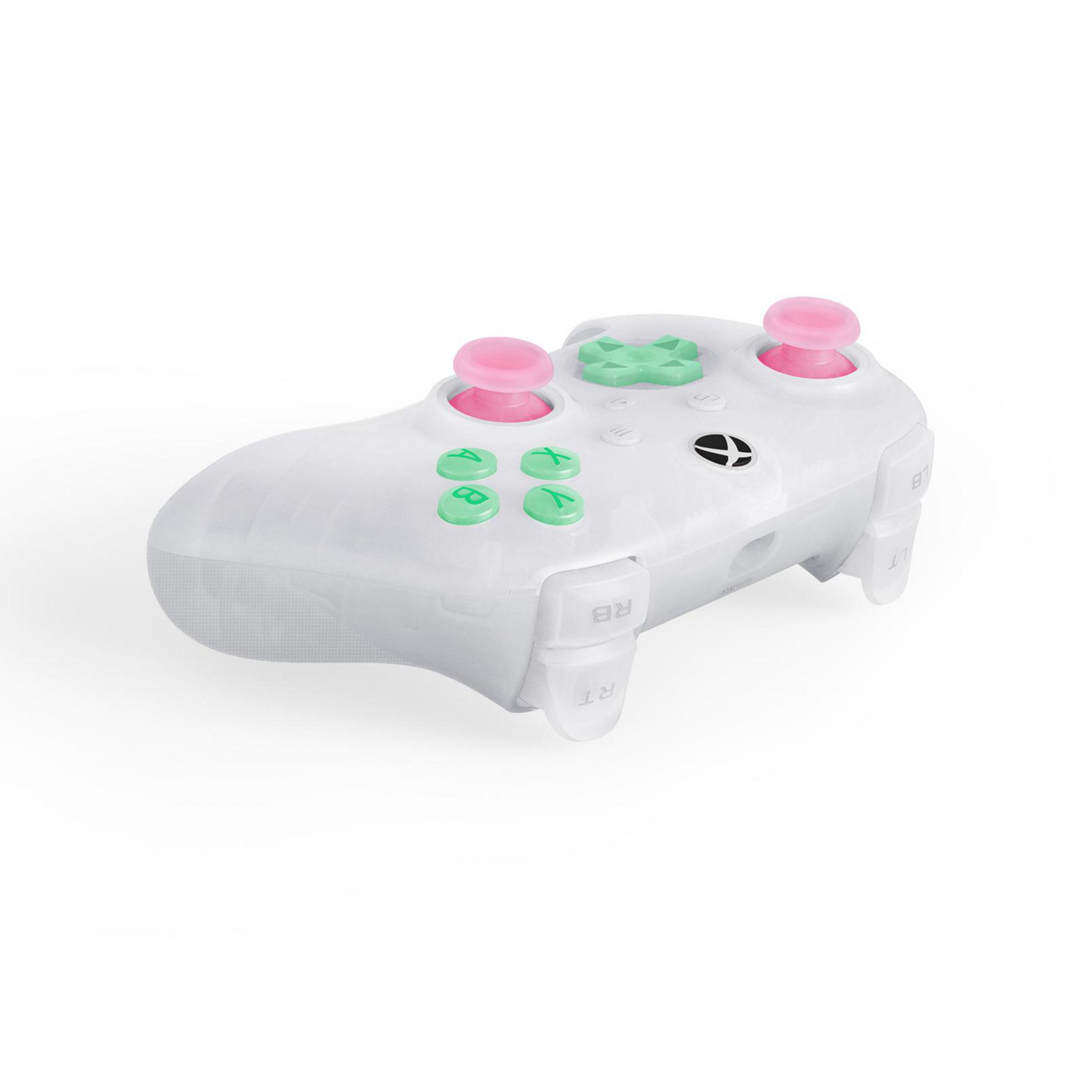 Un controller bianco con pulsanti rosa e verdi su sfondo bianco.