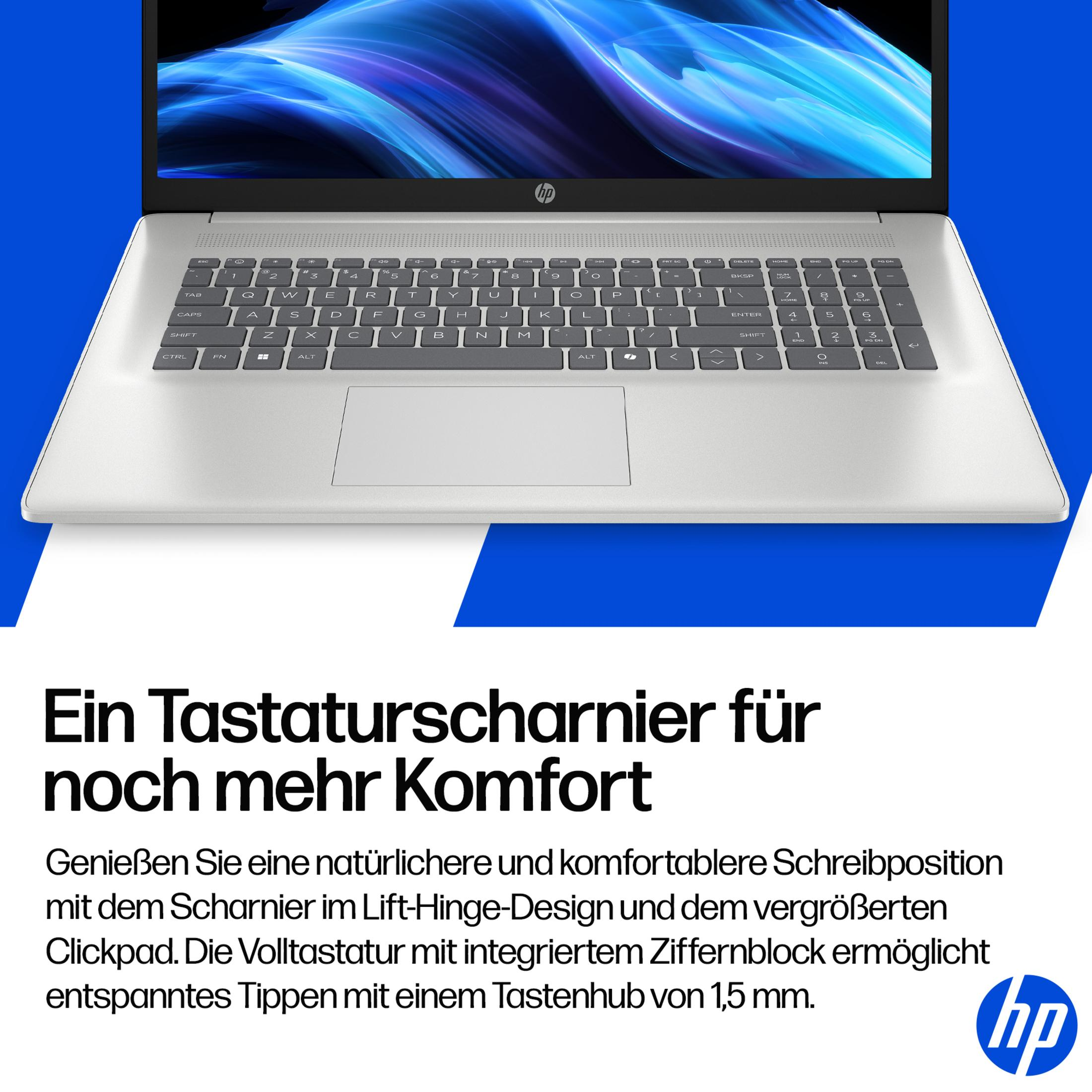 Silberner HP Laptop mit beleuchteter Tastatur und digitalem Hintergrund.