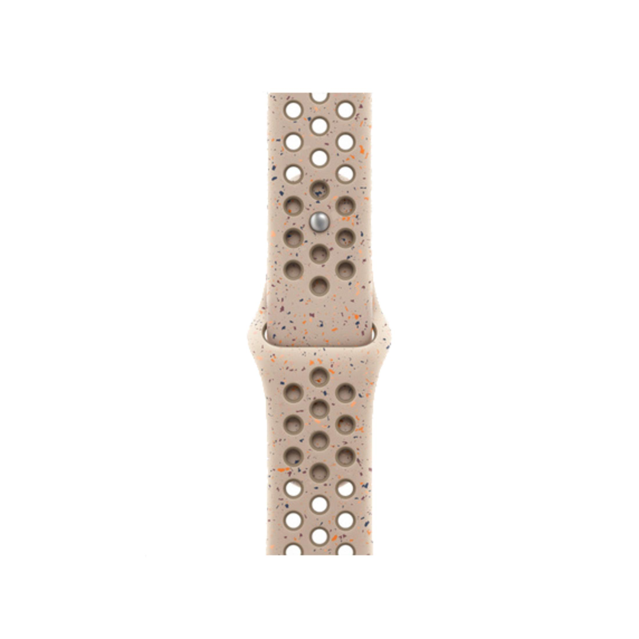 Ein beigefarbenes Armband mit Löchern und bunten Sprenkeln.