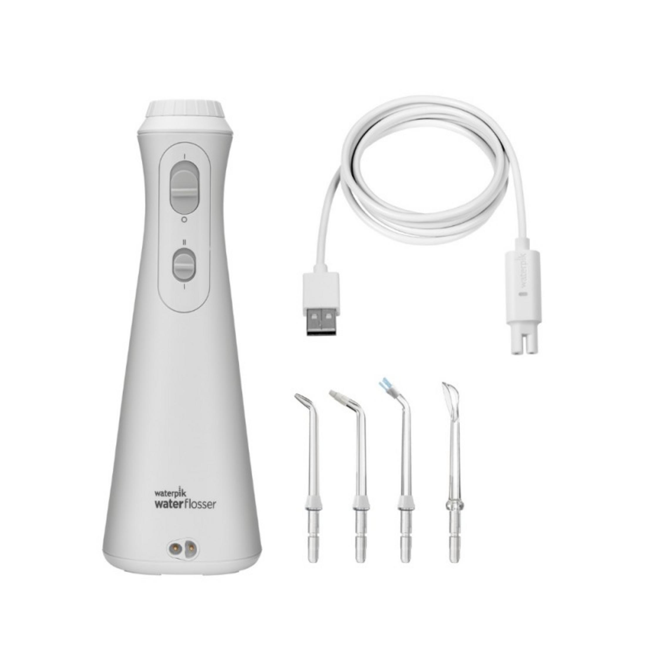 Un idropulsore bianco con cavo di ricarica USB e tre punte.