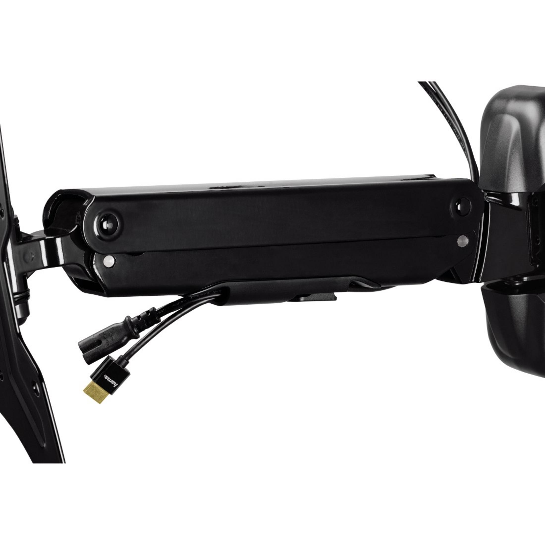 Brazo negro para monitor con cables y conector HDMI.