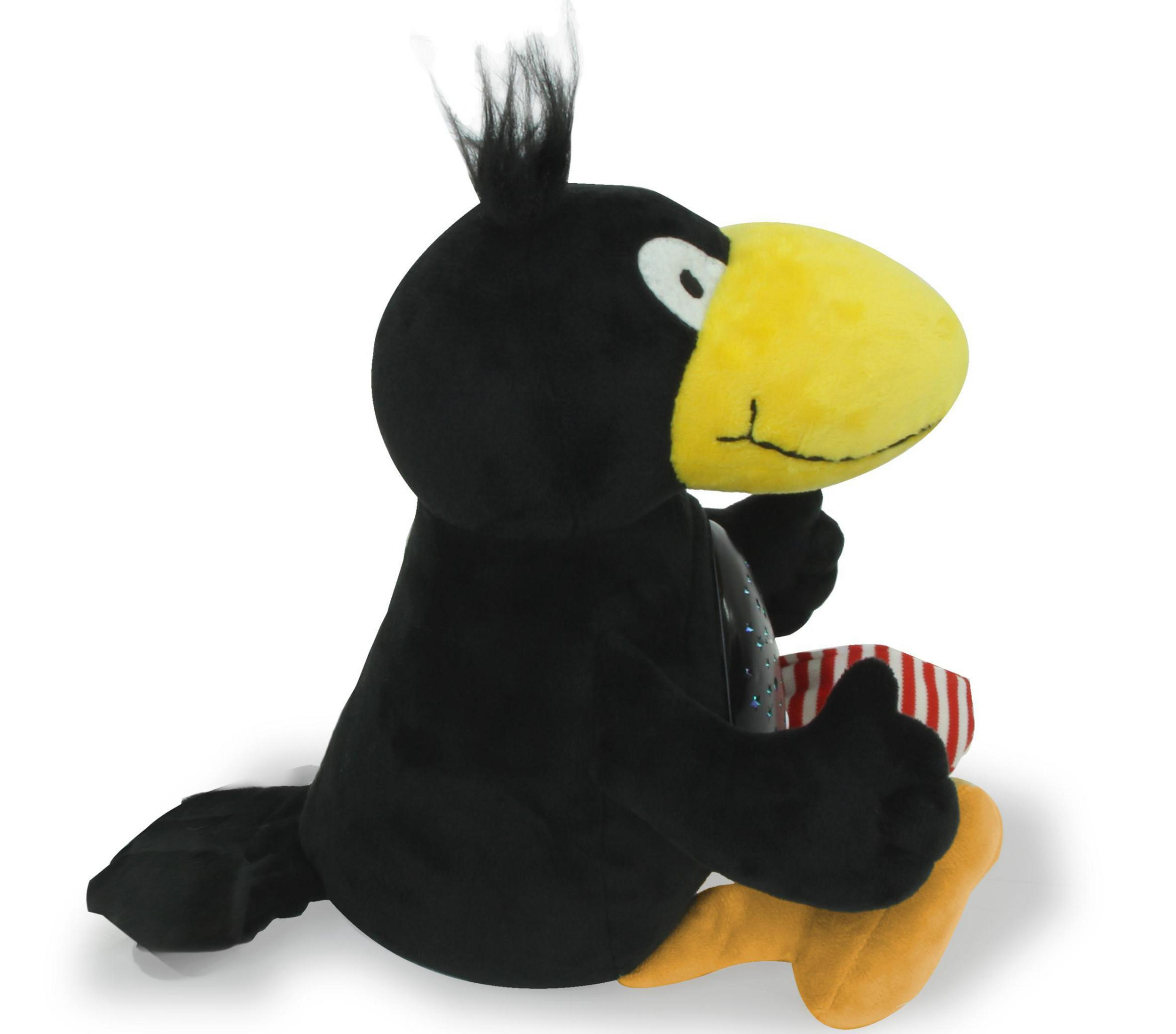 Ein schwarzes Plüschtier eines Vogels mit gelbem Schnabel sitzt da.