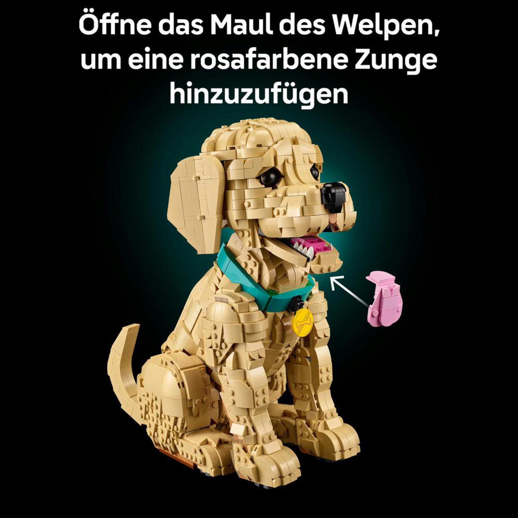 Un cane Lego beige con collare turchese seduto, bocca aperta, con un osso Lego rosa nelle vicinanze.