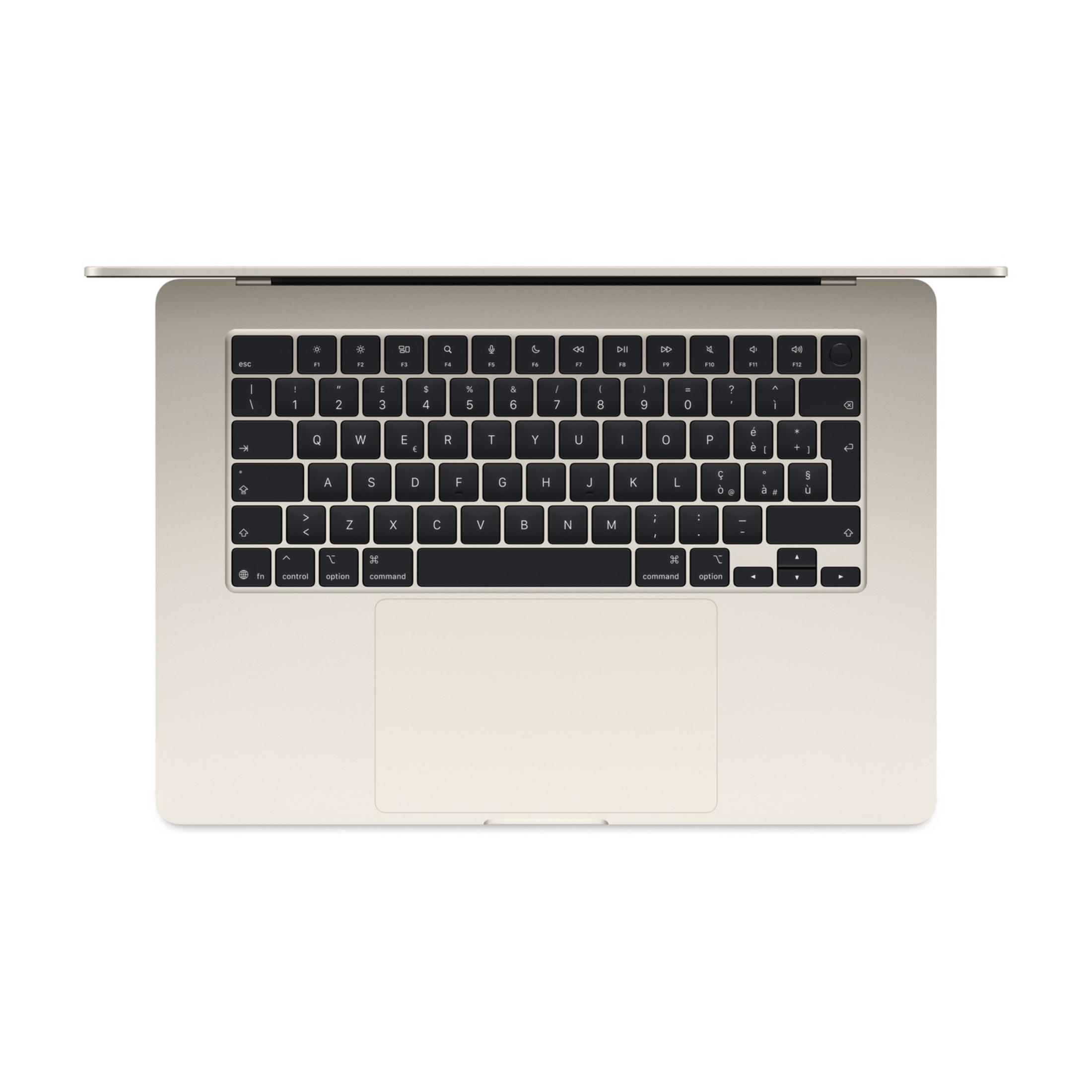 Un laptop color oro chiaro, visto dall'alto, con il coperchio aperto, che mostra la tastiera.