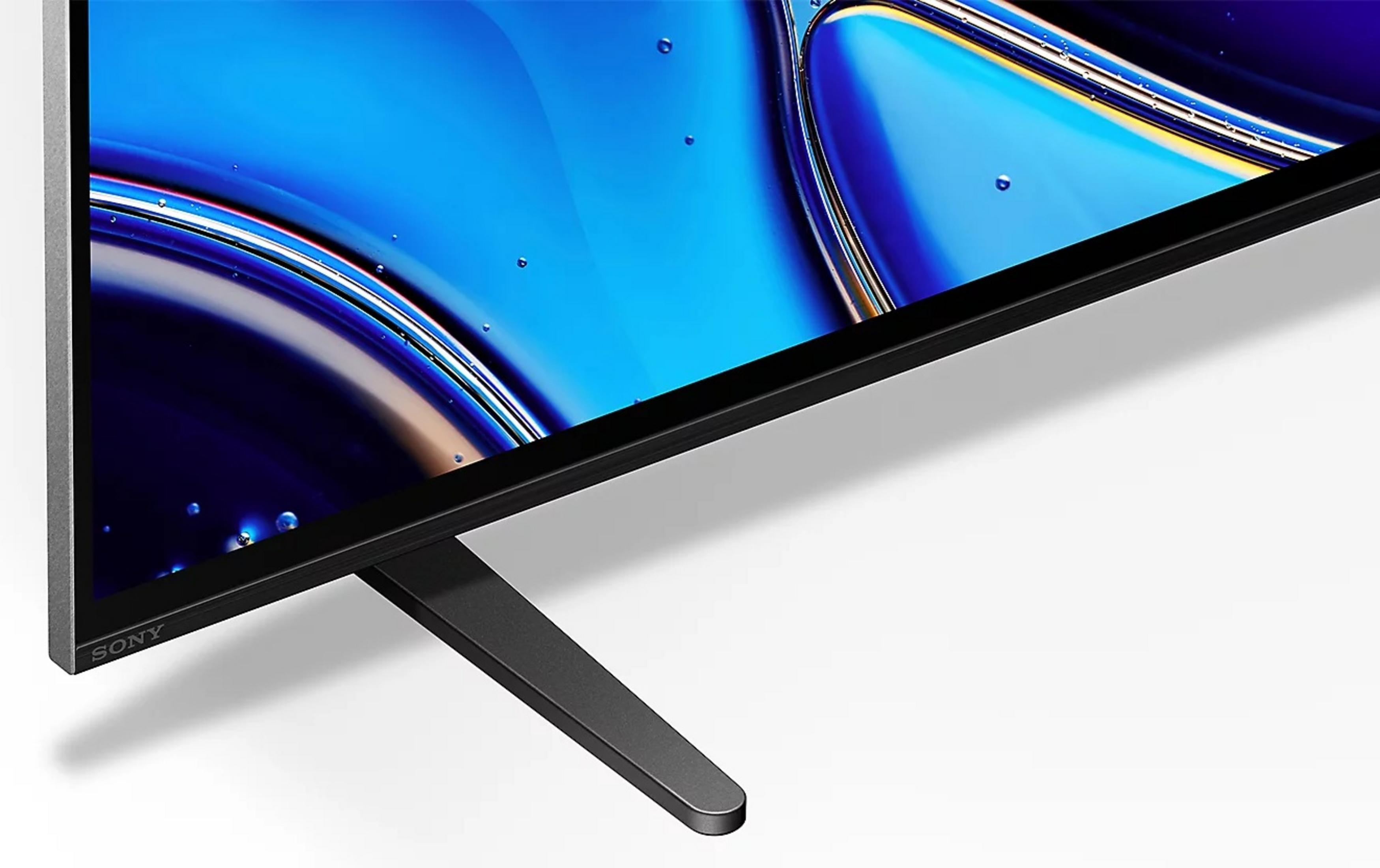 Primo piano di uno schermo TV con immagine astratta blu e supporto.