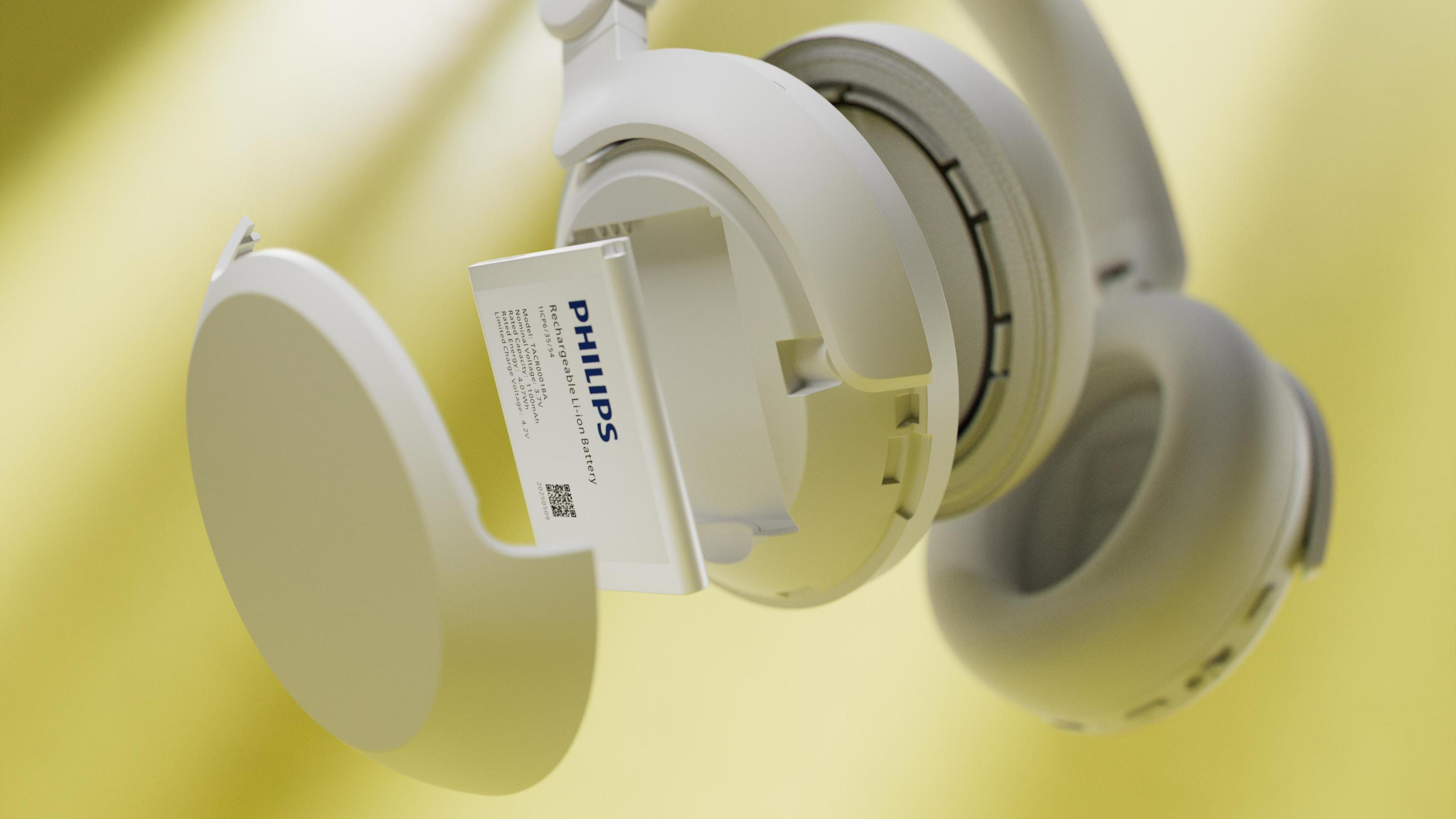 Weiße Philips Kopfhörer mit entnehmbarem Akku. Gelber Hintergrund.