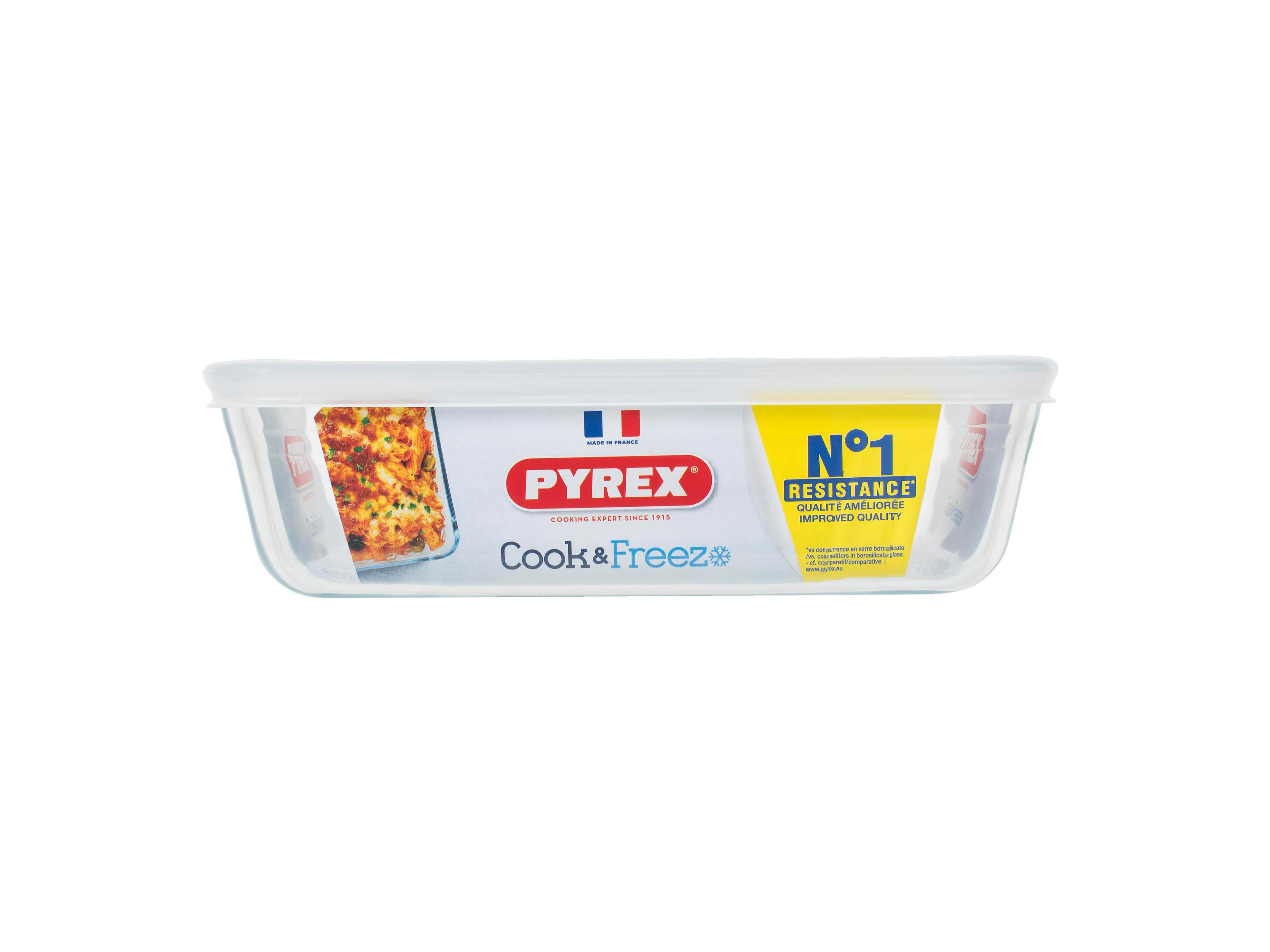 Piatto in vetro Pyrex con coperchio, ripieno di piatto di pasta.