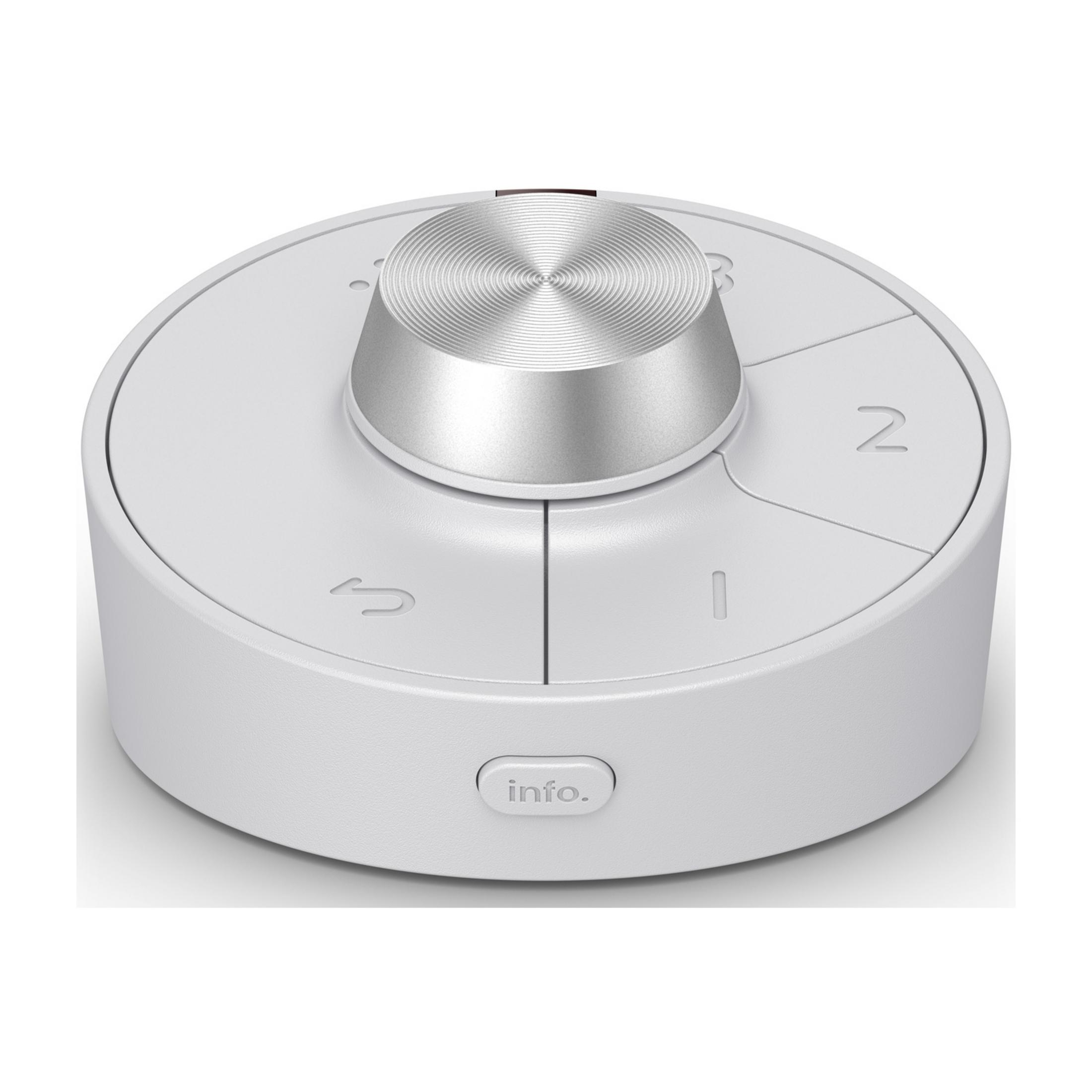Un controlador redondo blanco con un dial plateado y botones de navegación.