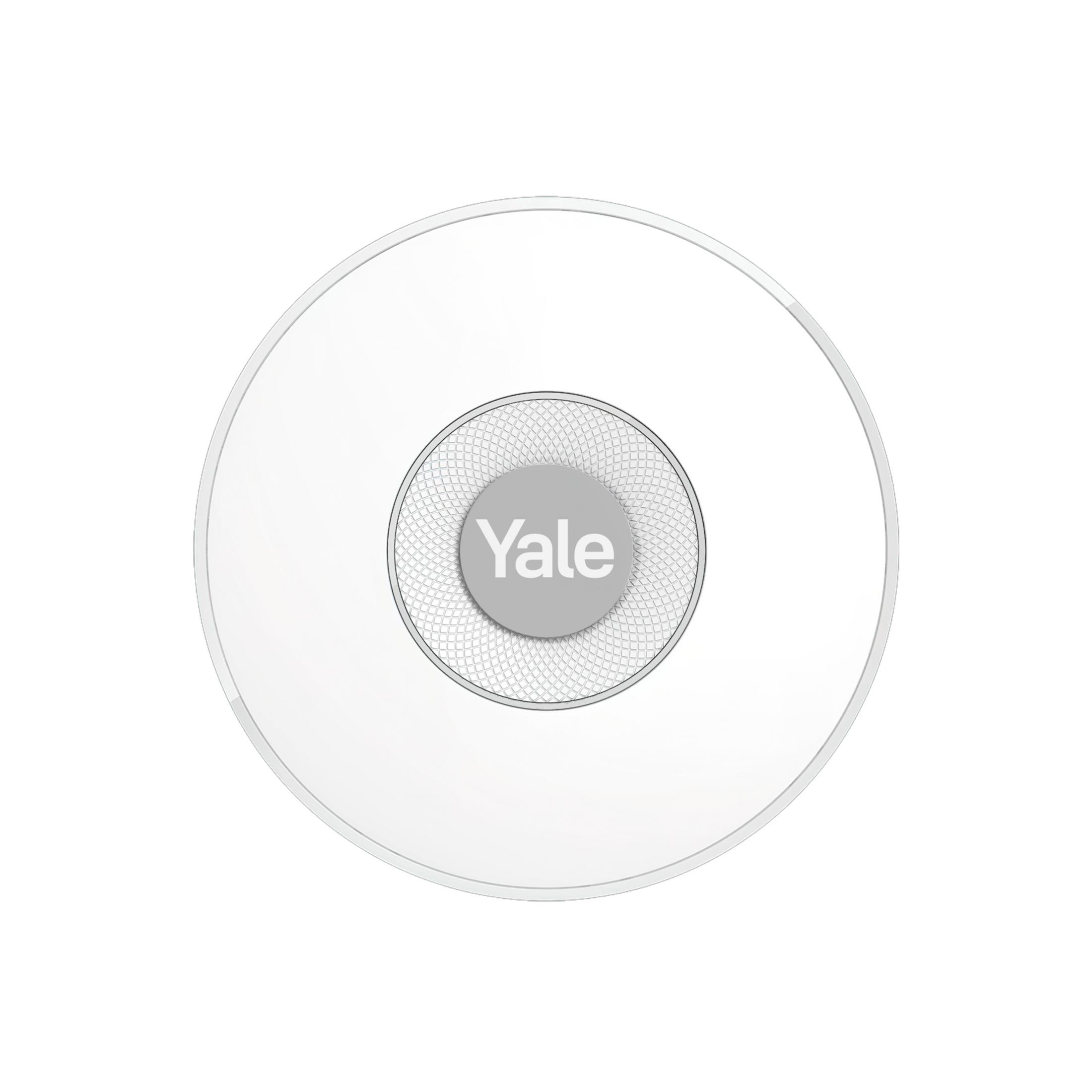Una maniglia rotonda bianca Yale con un motivo stilizzato.