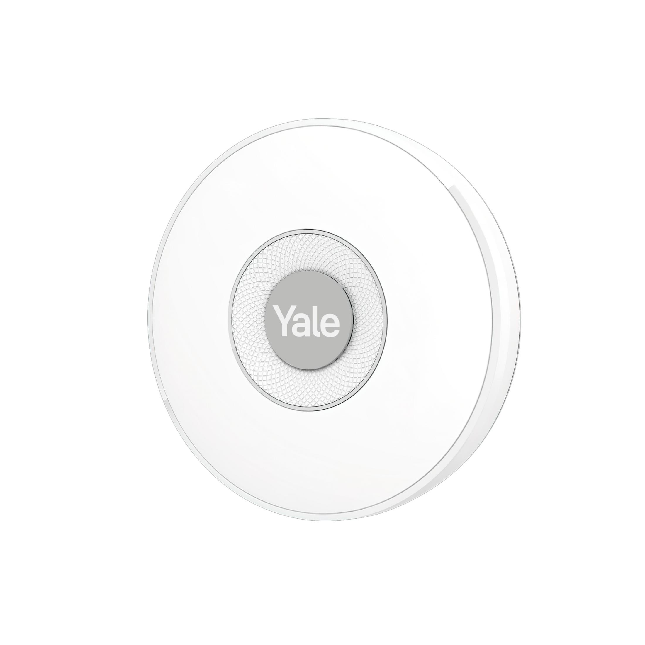 Un sensore porta Yale bianco e rotondo con un cerchio grigio al centro.