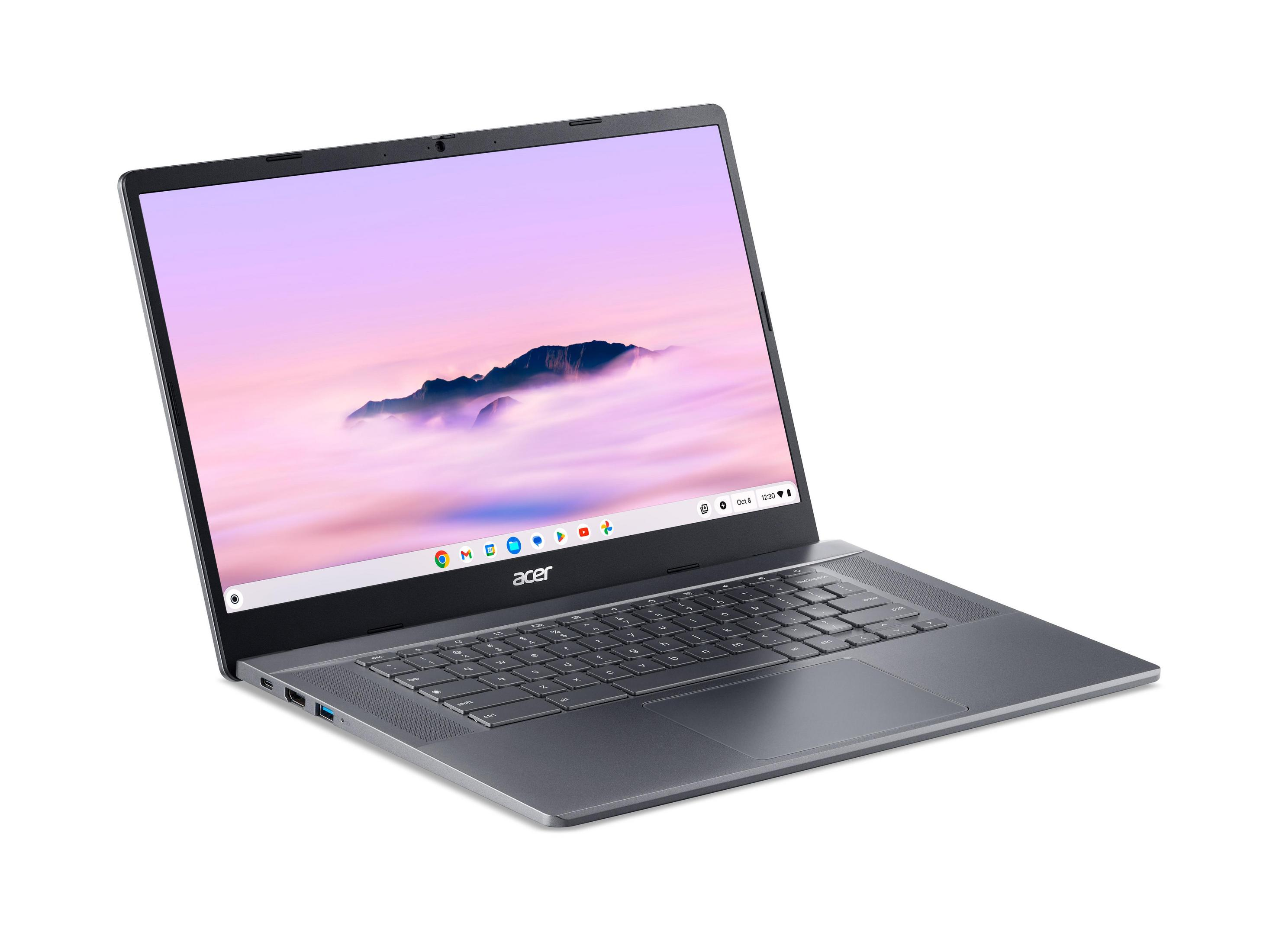 Ein geschlossenes graues Acer-Notebook mit einem Bildschirm, der einen Berg und Wolken zeigt.