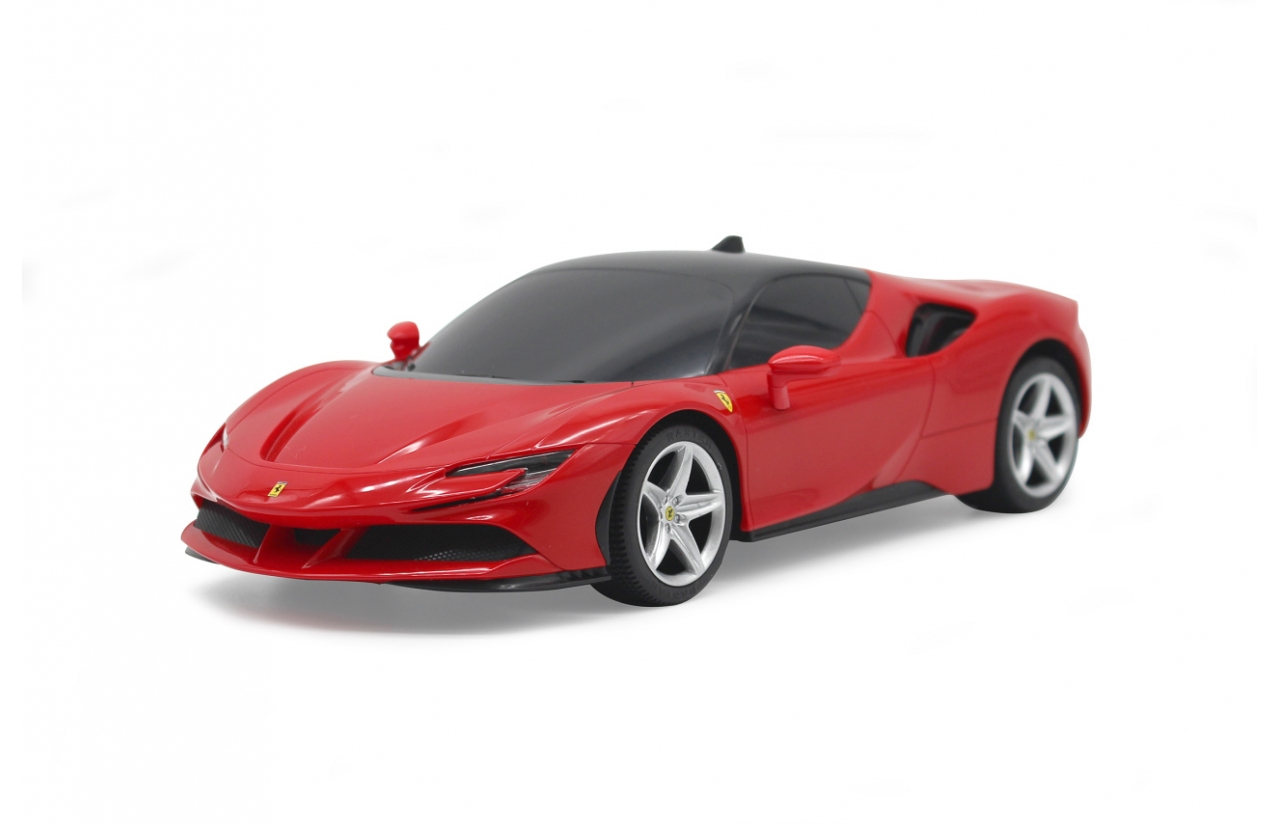 Ein rotes Ferrari-Spielzeugauto mit schwarzem Dach steht auf weißem Hintergrund.